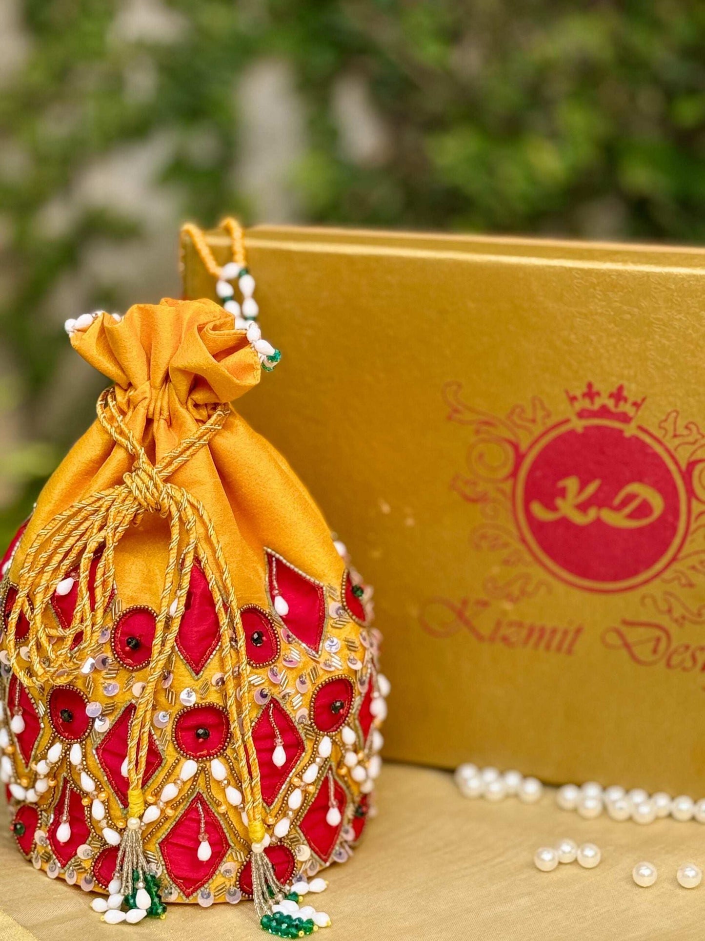 RAAGYA HAND EMBROIDERED CHROME YELLOW POTLI.