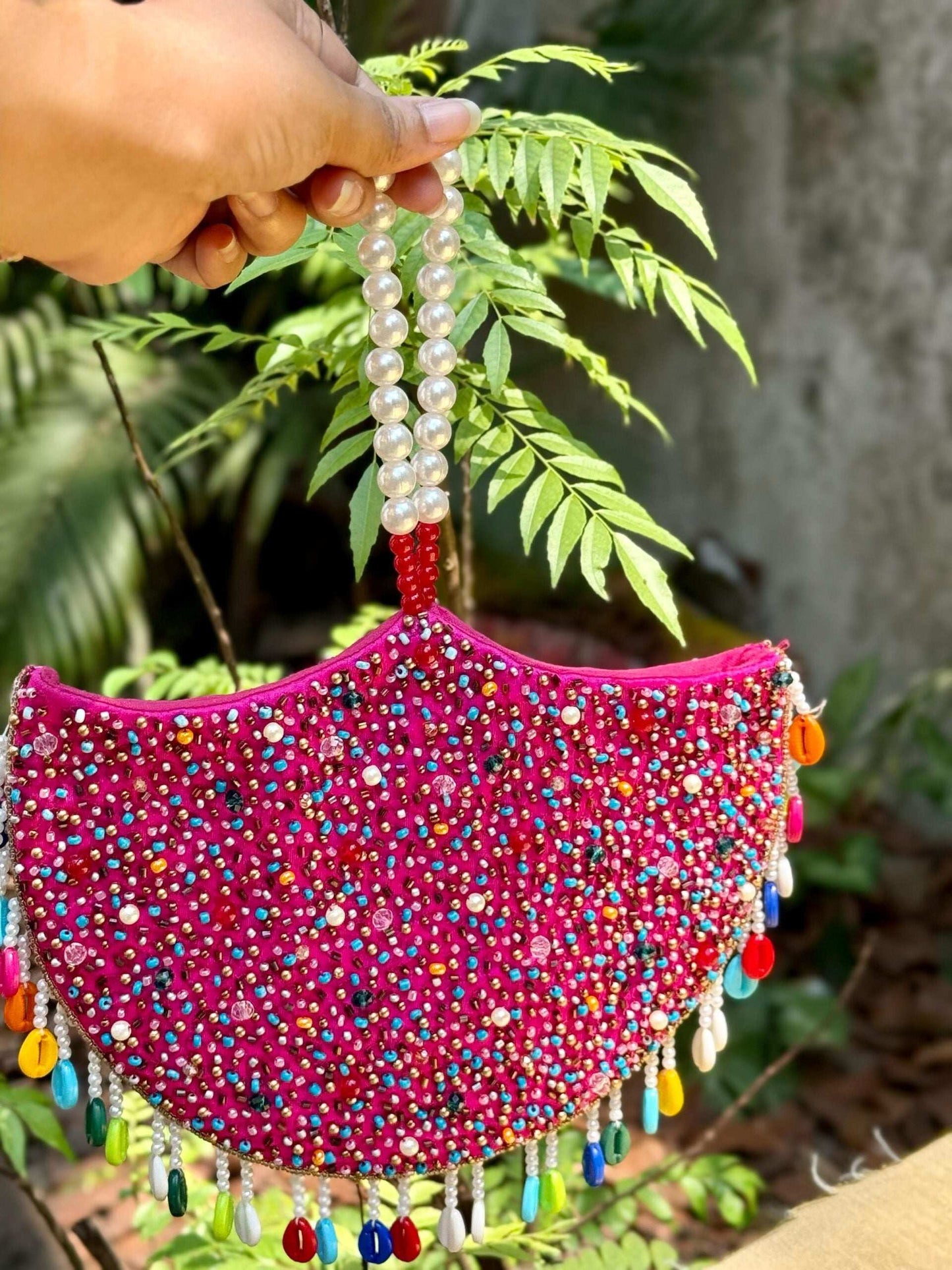 TARA JHUMKA HAND EMBROIDERED CLUTCH POTLI.