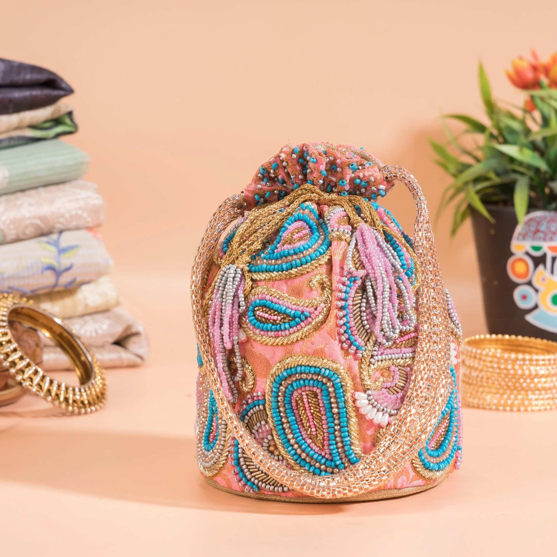 Flamingo Pink Brocade Ambi Potli Bag.