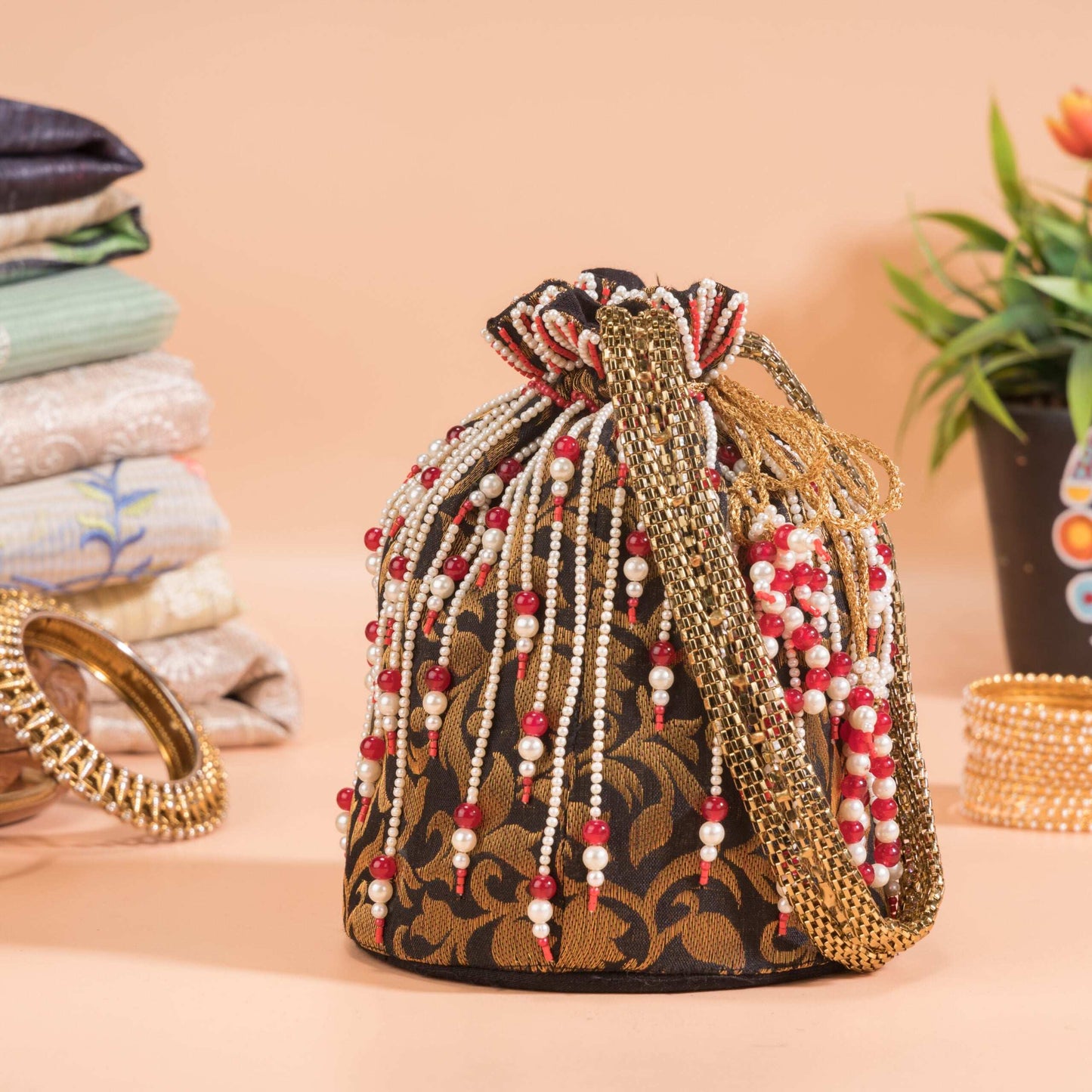 Black Jazz Golden Floral Brocade Potli Bag.