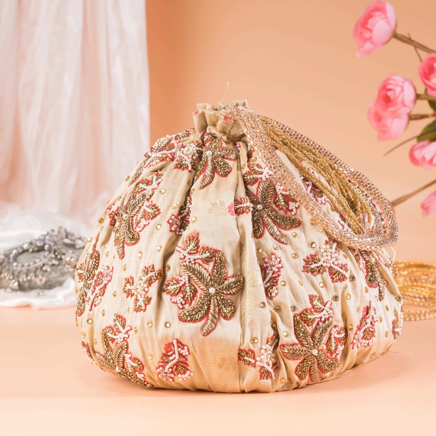 Beige Brocade Floral Potli Bag.