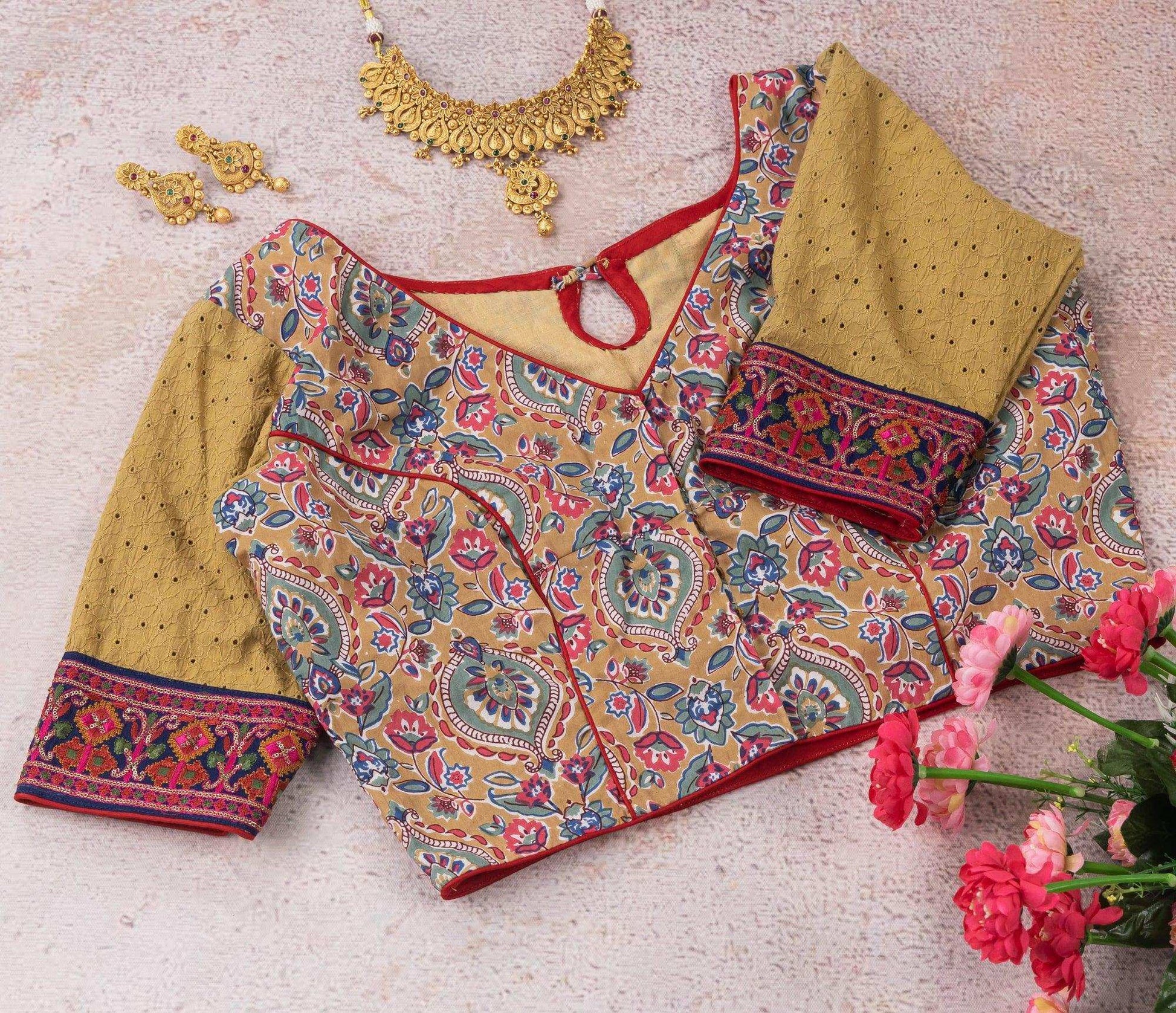 Beige floral embroidered blouse.