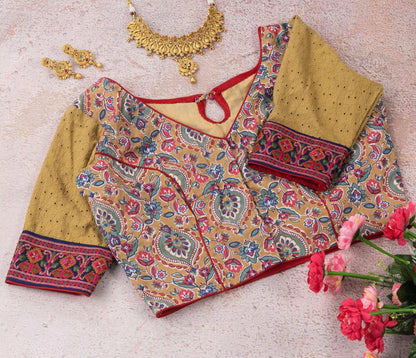 Beige floral embroidered blouse.