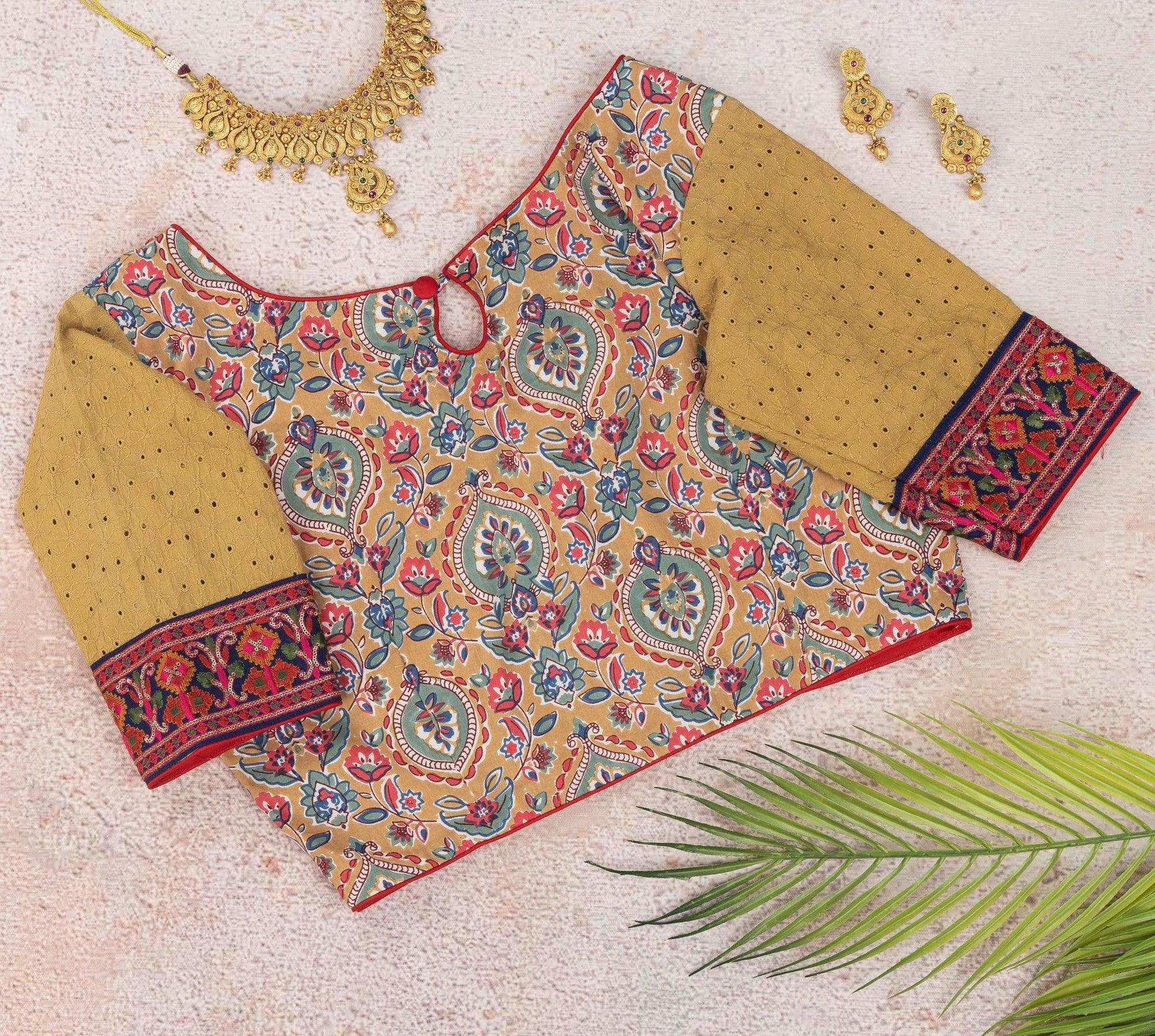 Beige floral embroidered blouse.