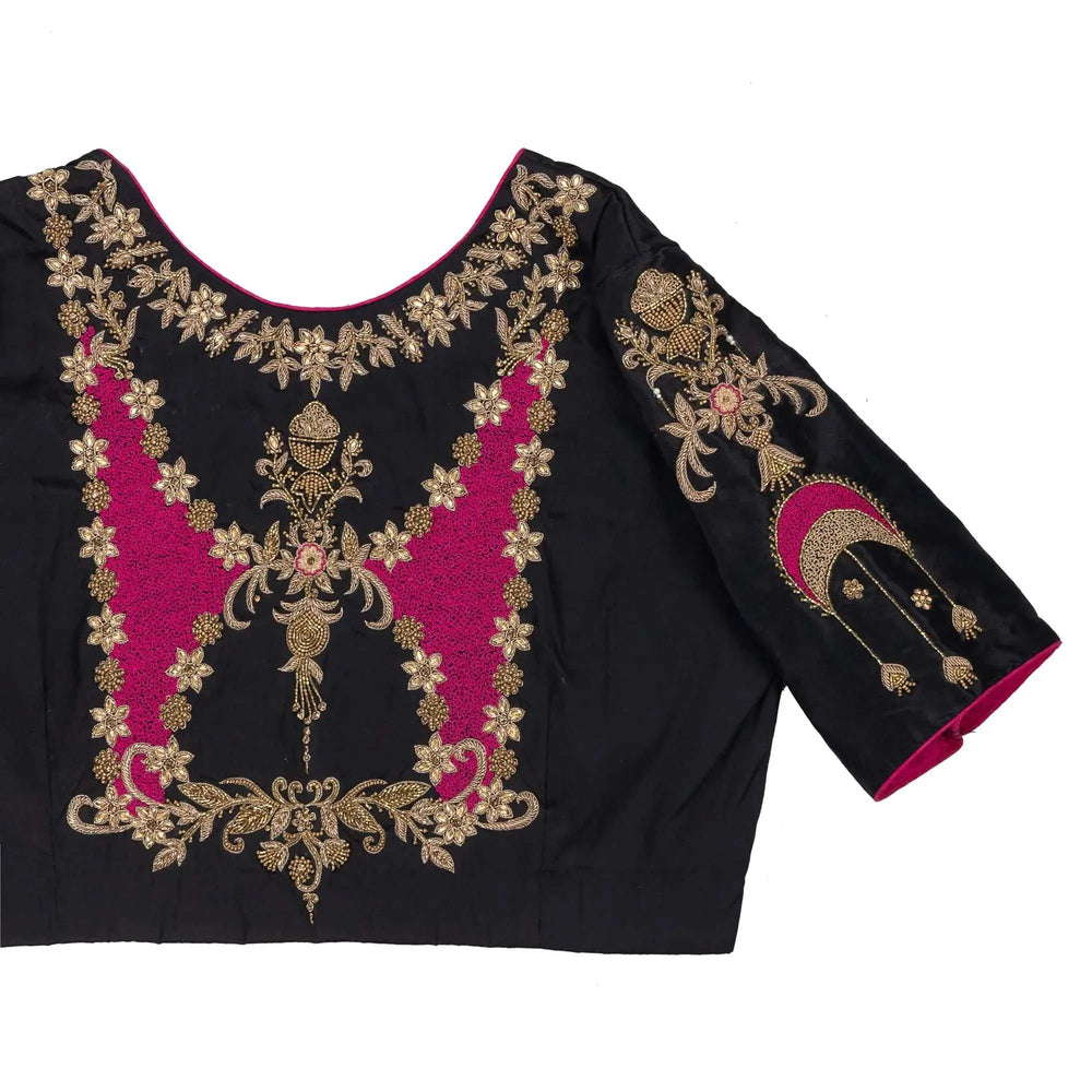 Close-up of the gold and pink zari embroidery on the blouse back and sleeve