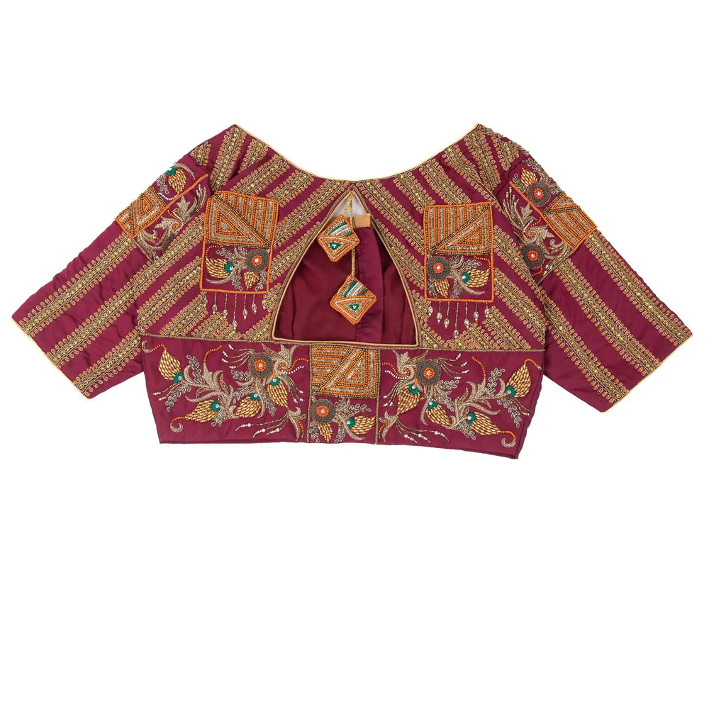 Keyhole and dori between gold striped panels, blouse laid flat on white