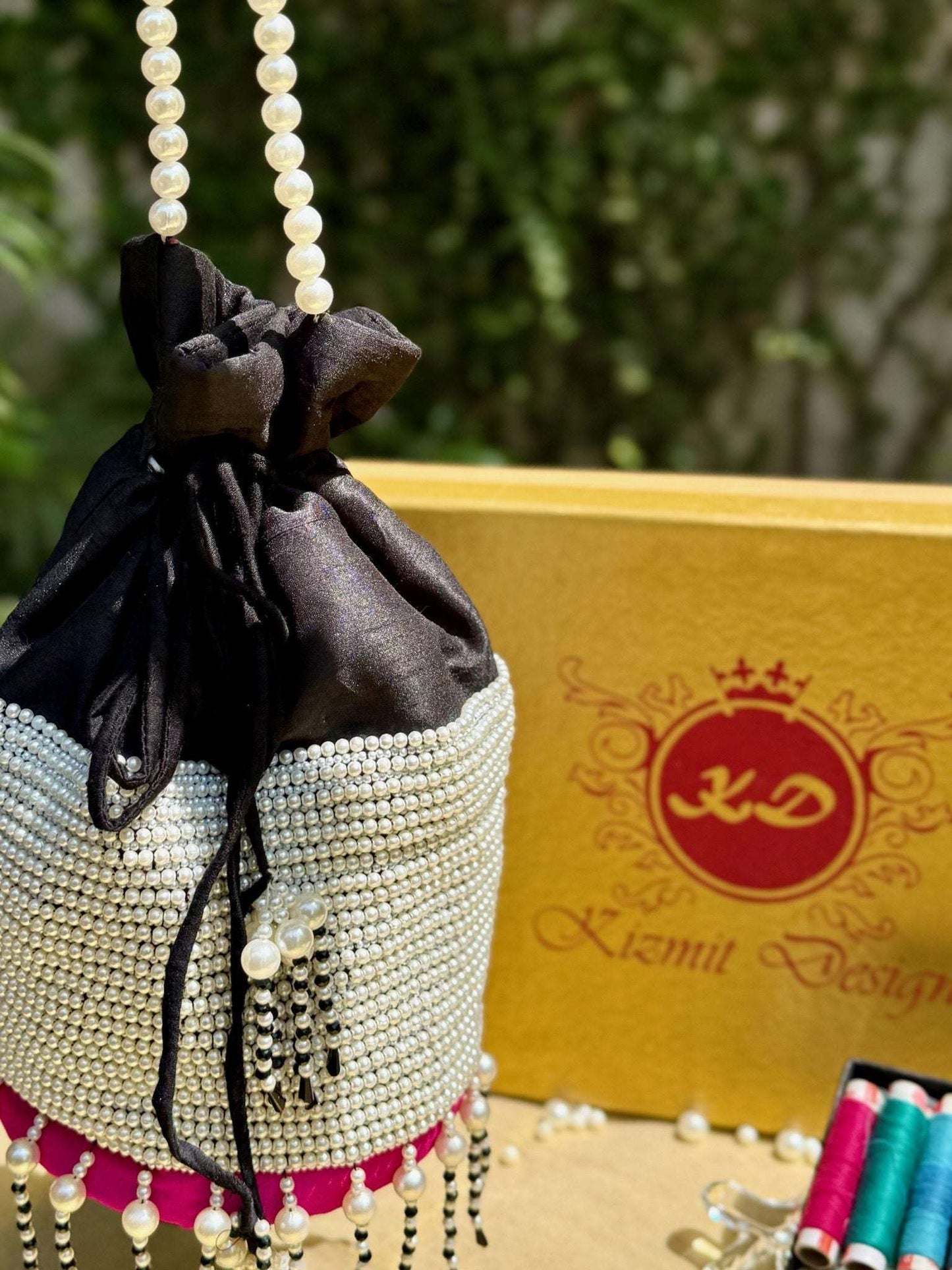 MOTI MALLIKA HAND EMBROIDERED POTLI BAG.