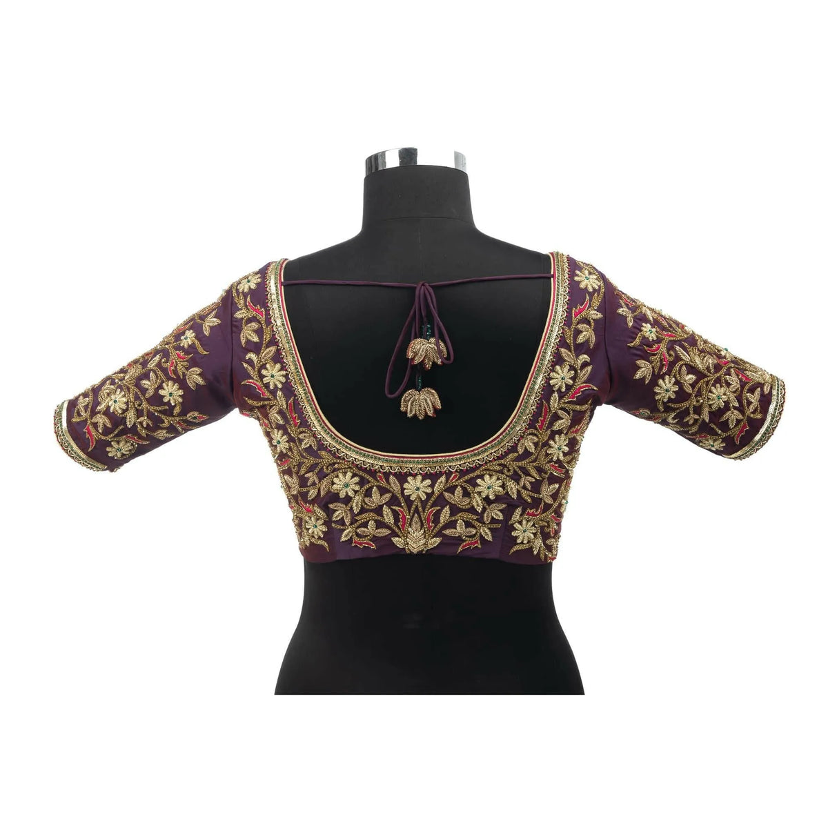 Back view on a bust form showing floral embroidery and a dori tie-up with tasselled ends
