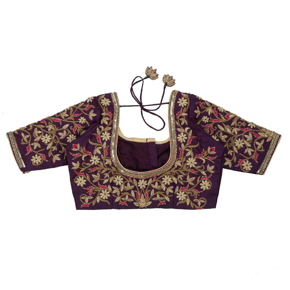 Purple blouse laid flat back up, sleeves spread to show gold floral work and dori strings