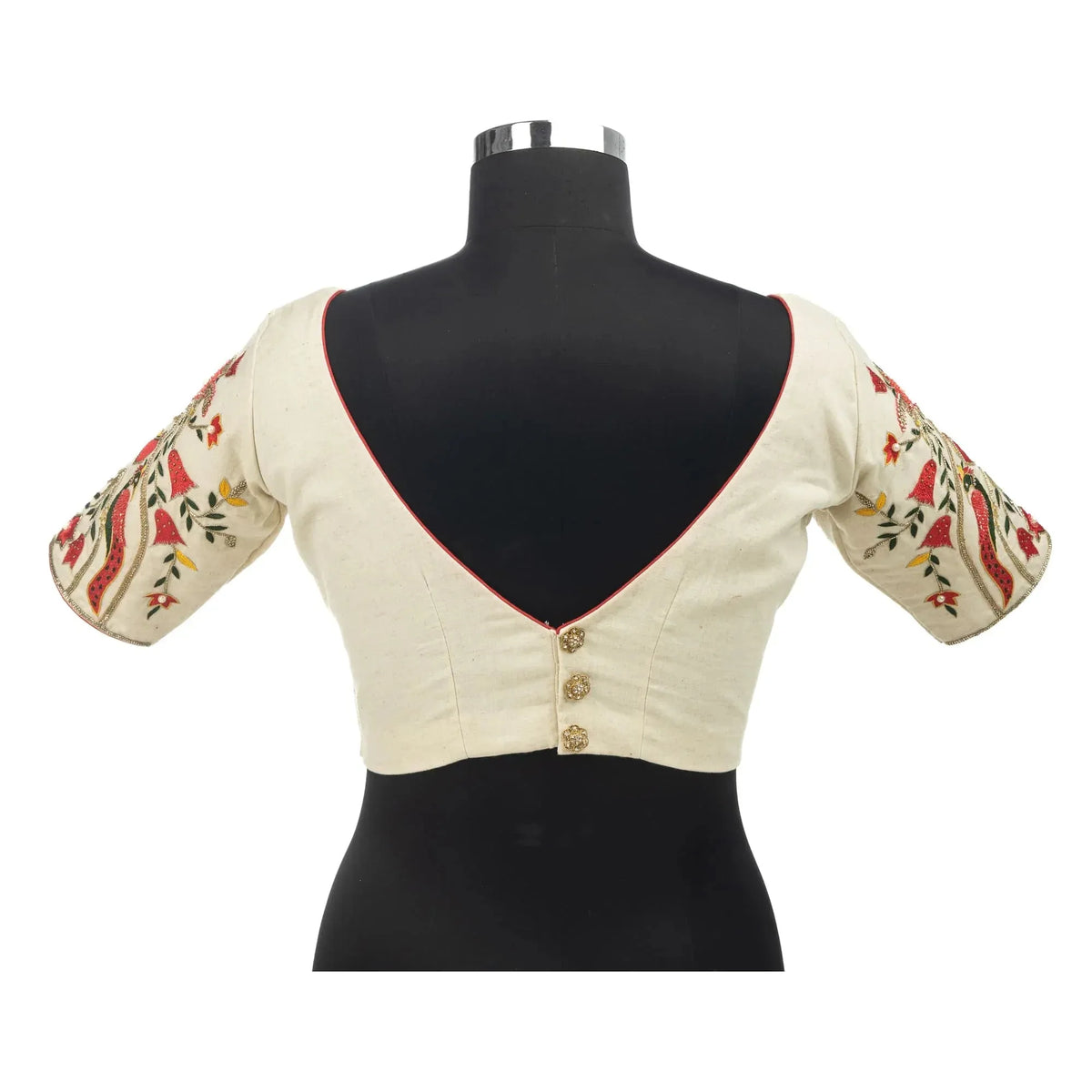 Deep V back with three buttons on a bust form, ivory blouse with embroidered sleeves