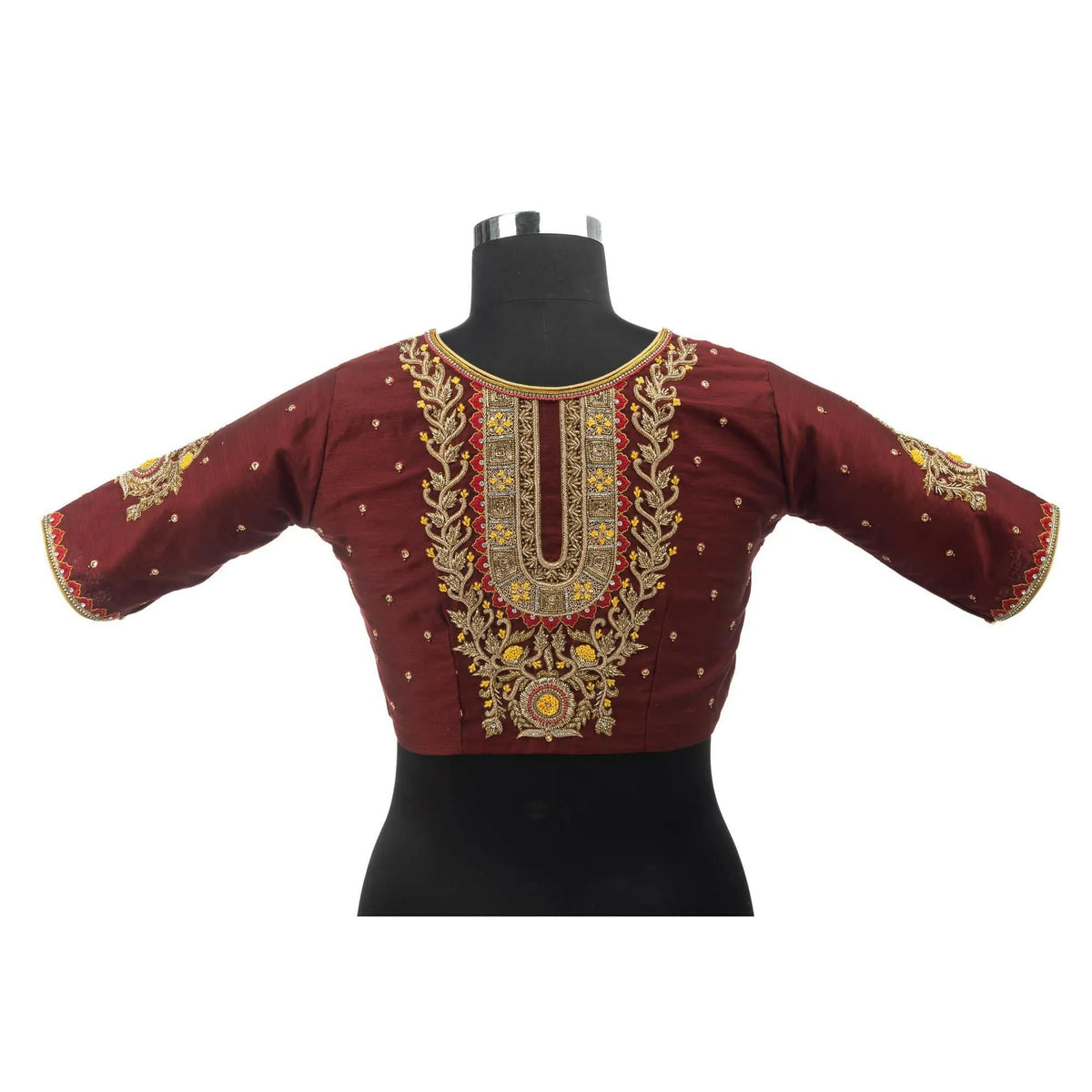 Embroidered maroon blouse on a bust form, gold zardozi panel running down the centre