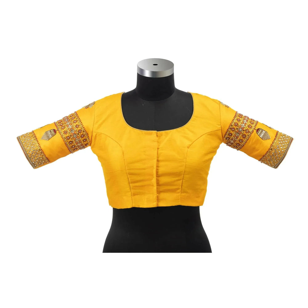 Front on a bust form, plain marigold yellow with hook placket and embroidered sleeve cuffs