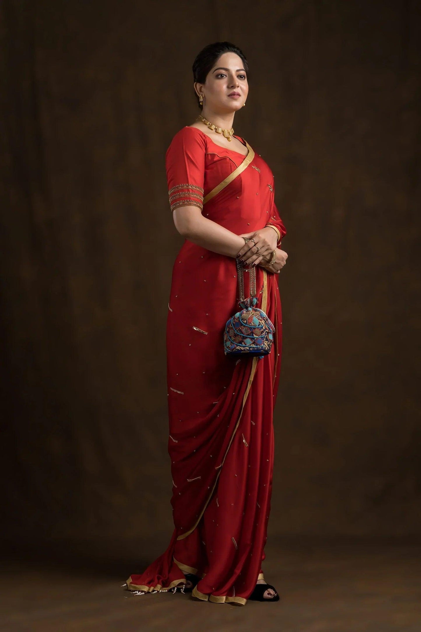 Egyptian Blue Brocade Geometrical Potli Bag.