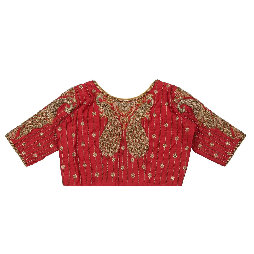 Blouse back laid flat, a pair of peacocks rising at the centre among gold booti sprays