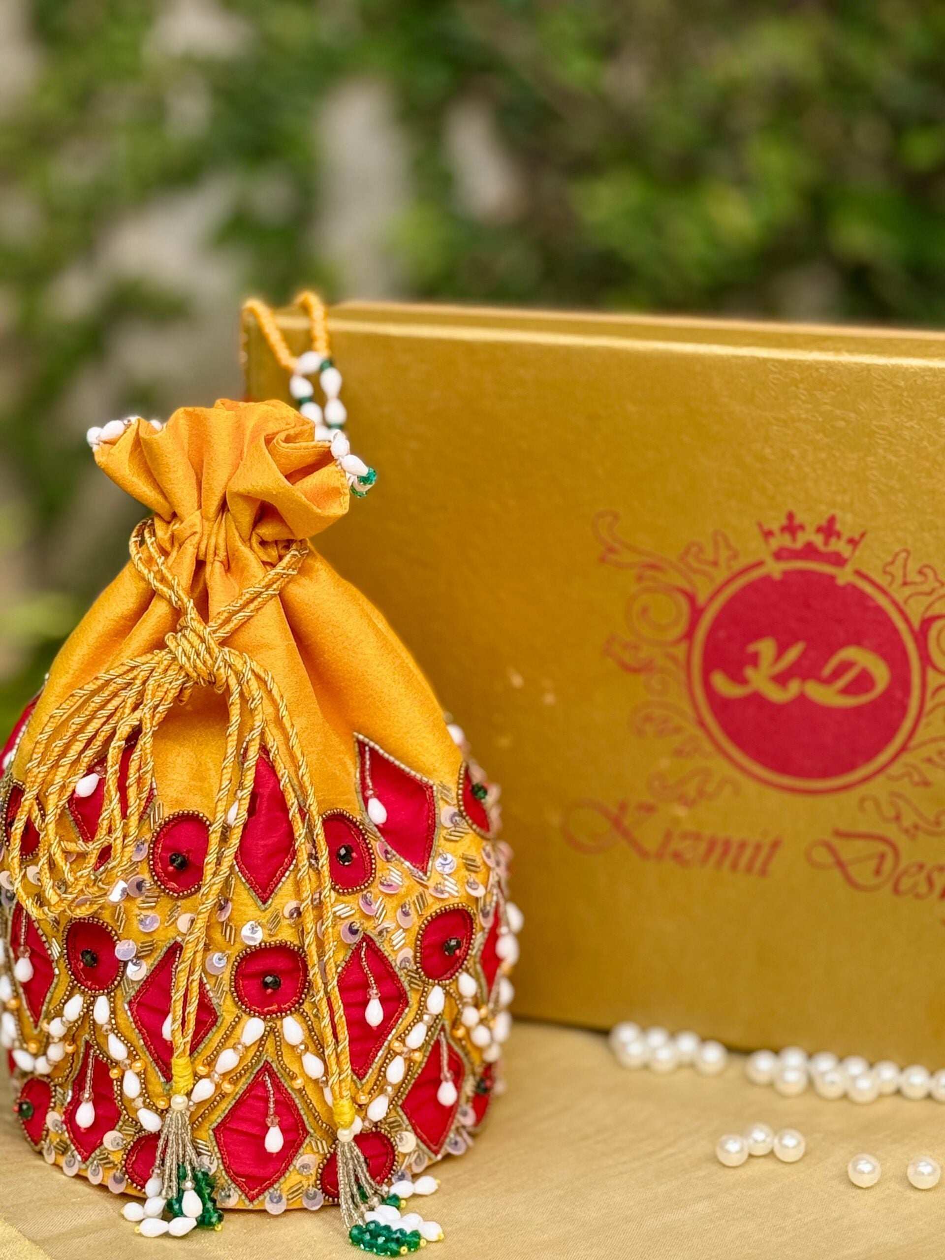 RAAGYA HAND EMBROIDERED CHROME YELLOW POTLI.