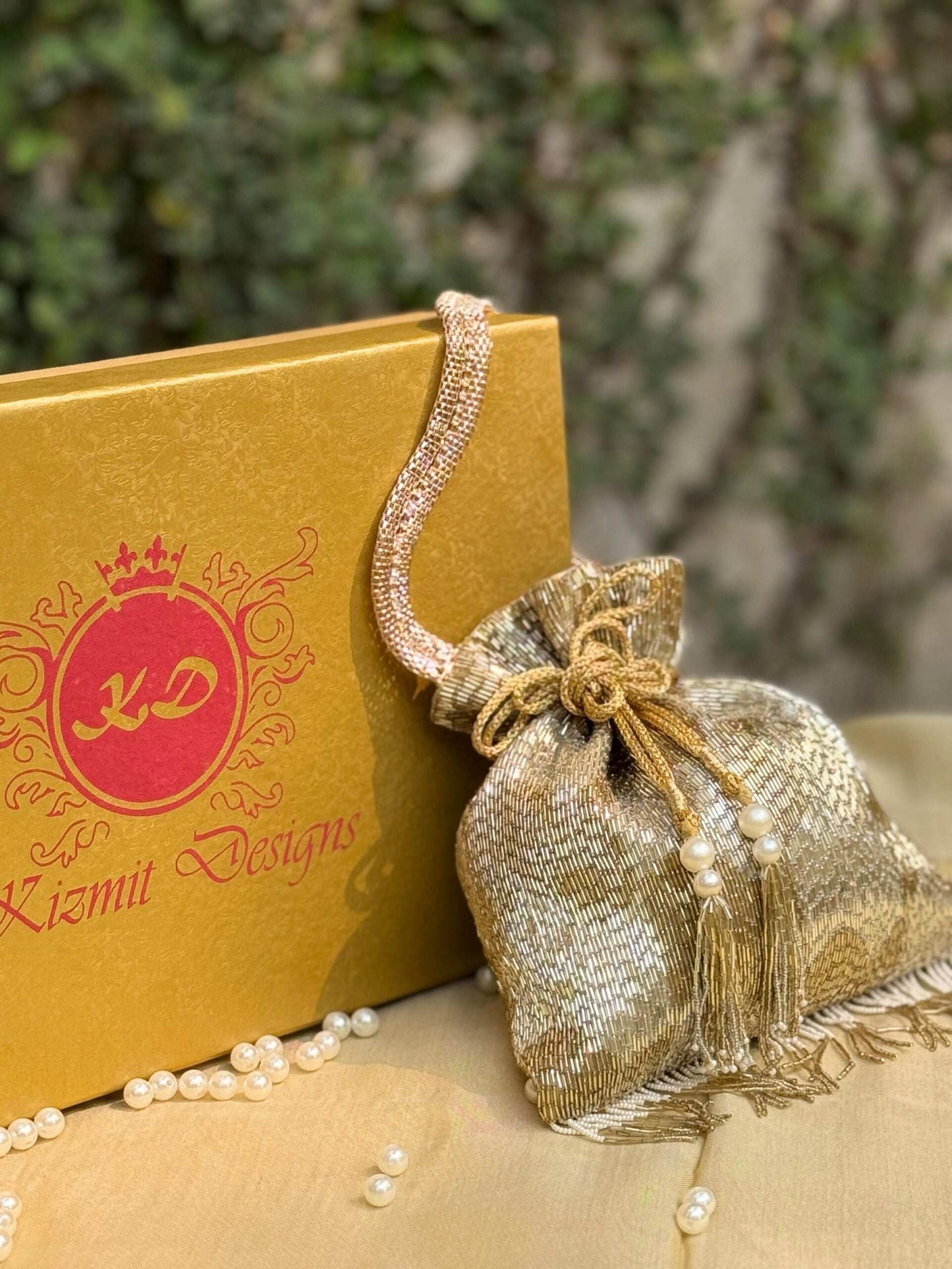 ZARNIKA HAND EMBROIDERED POTLI.