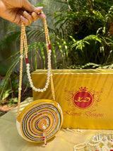 SAANJHIKA HAND EMBROIDERED ROUND BAG.