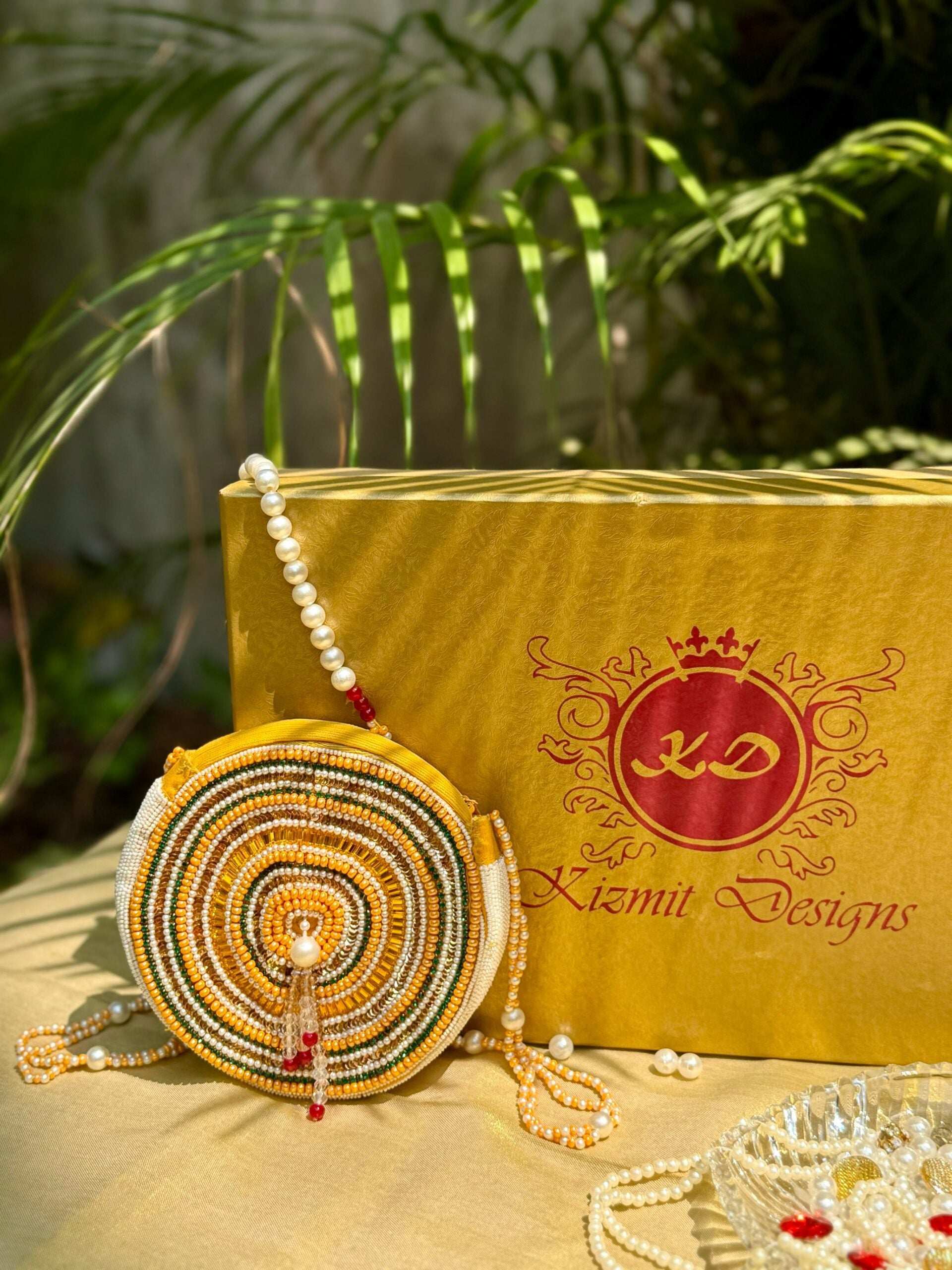 SAANJHIKA HAND EMBROIDERED ROUND BAG.
