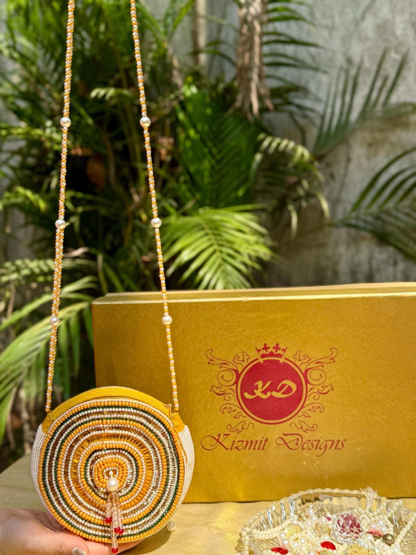 SAANJHIKA HAND EMBROIDERED ROUND BAG.