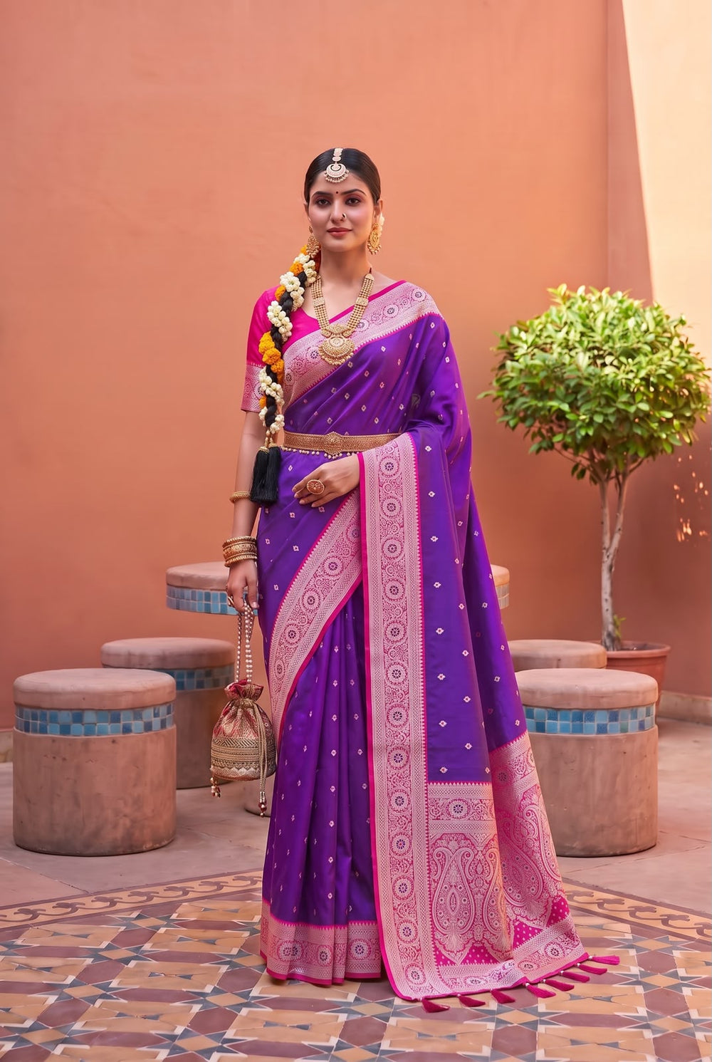Model wearing the indigo violet Banarasi Paithani saree with rani pink contrast border