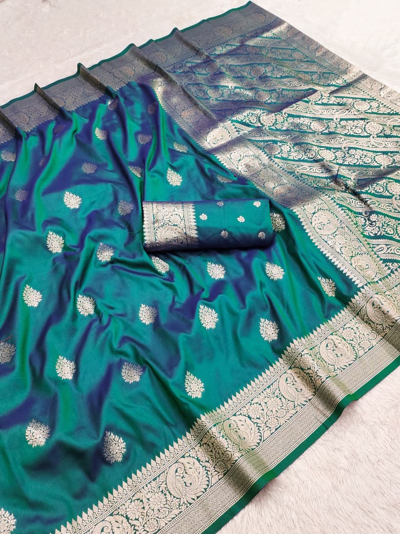 Teal green dual-tone shot silk Banarasi saree with allover zari buta and rich paisley pallu