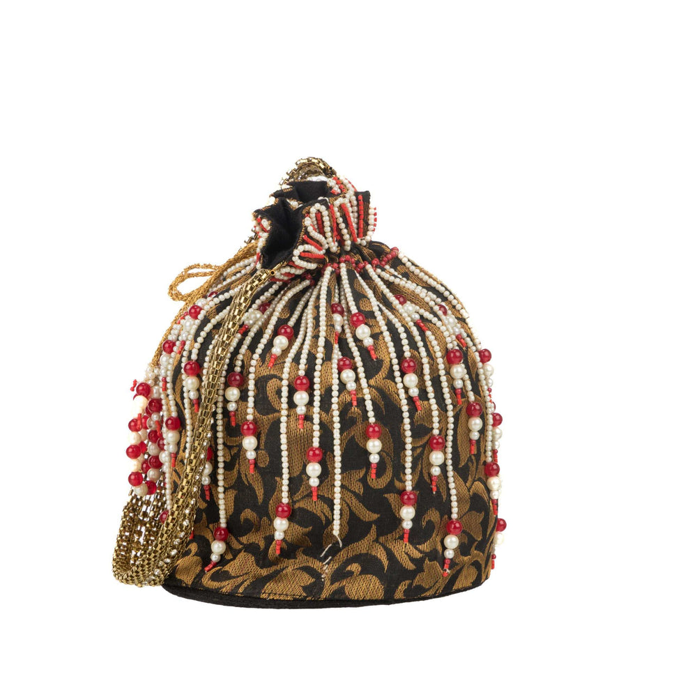 Black potli standing upright, gold floral brocade and beaded tassels in full view