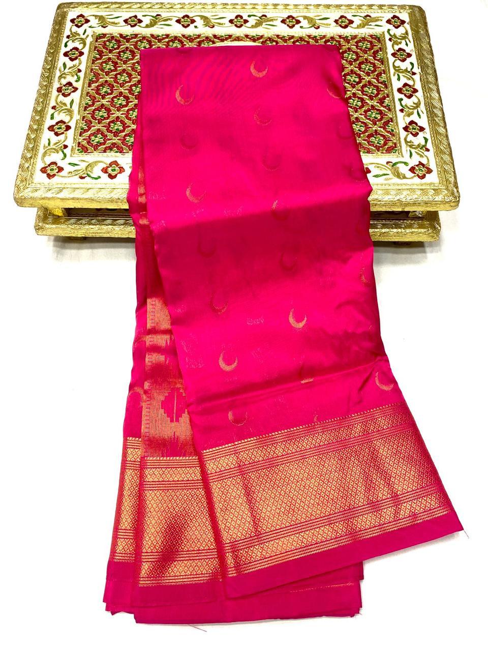 Zari chandrakor bootis catching light across the Paithani saree