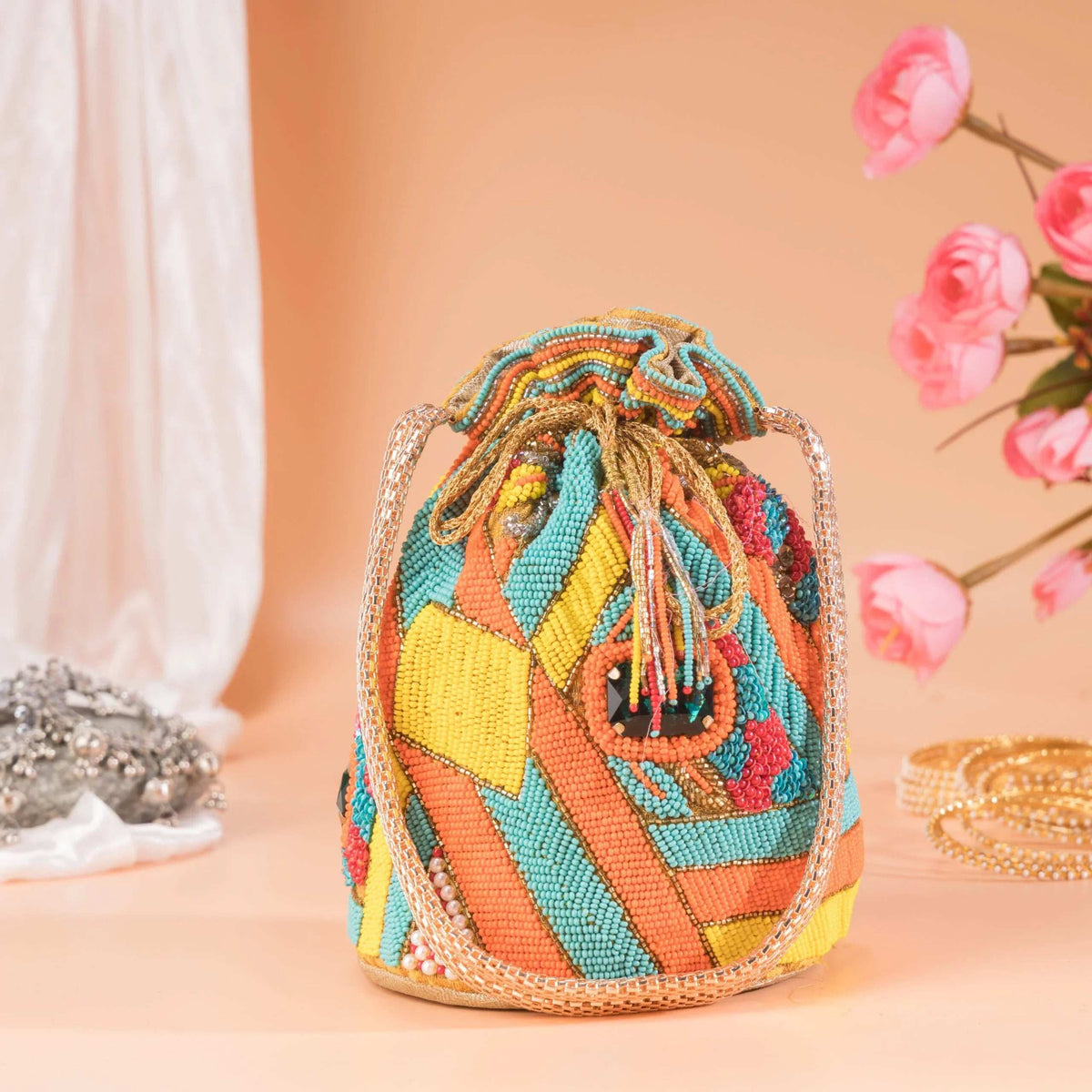 Multicolour beadwork potli in yellow, orange and turquoise, drawstring gathered at the top