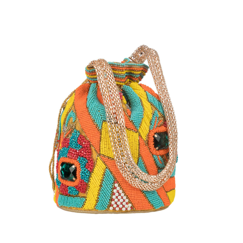 Beaded potli bag on white with a doubled gold rope handle and green stone accents