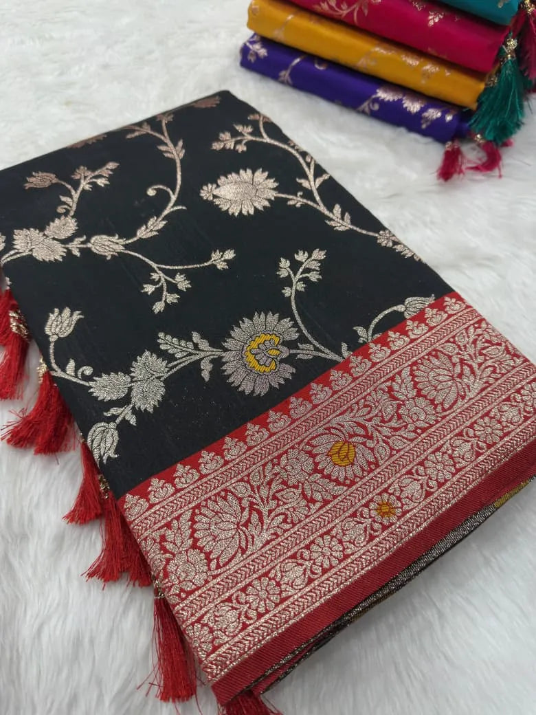 Black saree folded to show the zari floral buti work and wide red brocade border