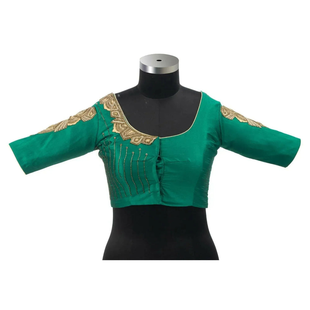 Front view of the green blouse on a black bust form, elbow-length sleeves