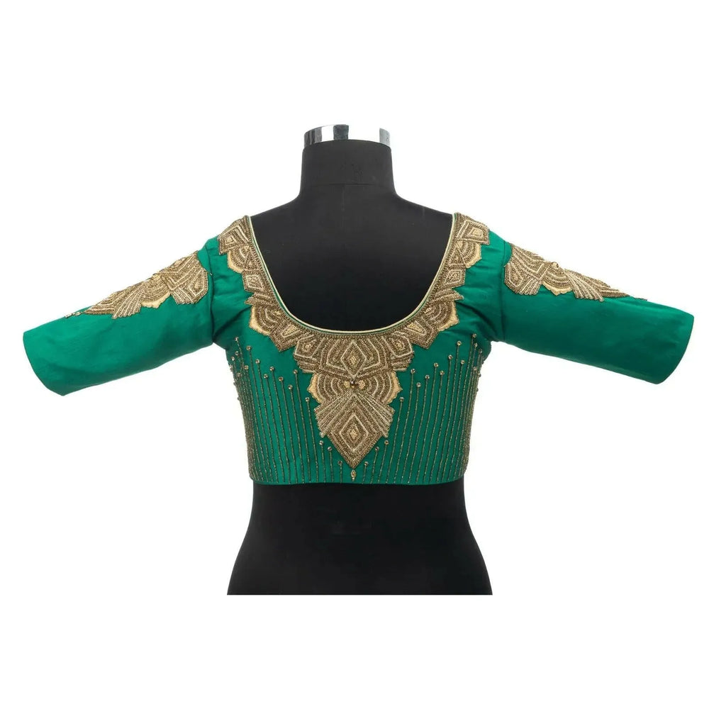Back view on a bust form showing the round neck and embroidered yoke