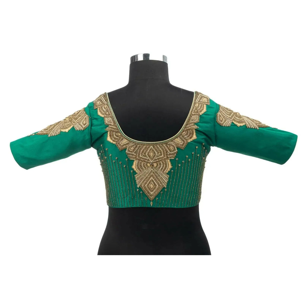 Back view on a bust form showing the round neck and embroidered yoke