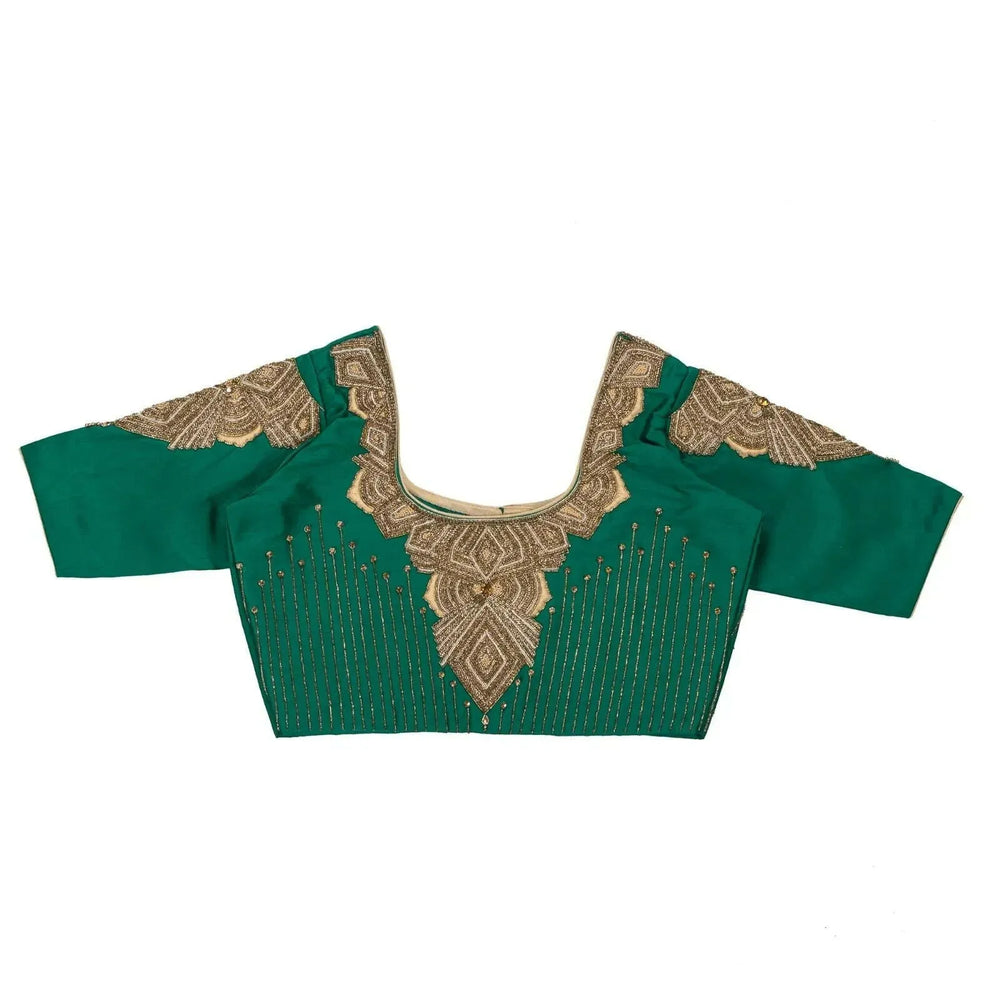 Flat back view with geometric gold motifs on the yoke and sleeve caps