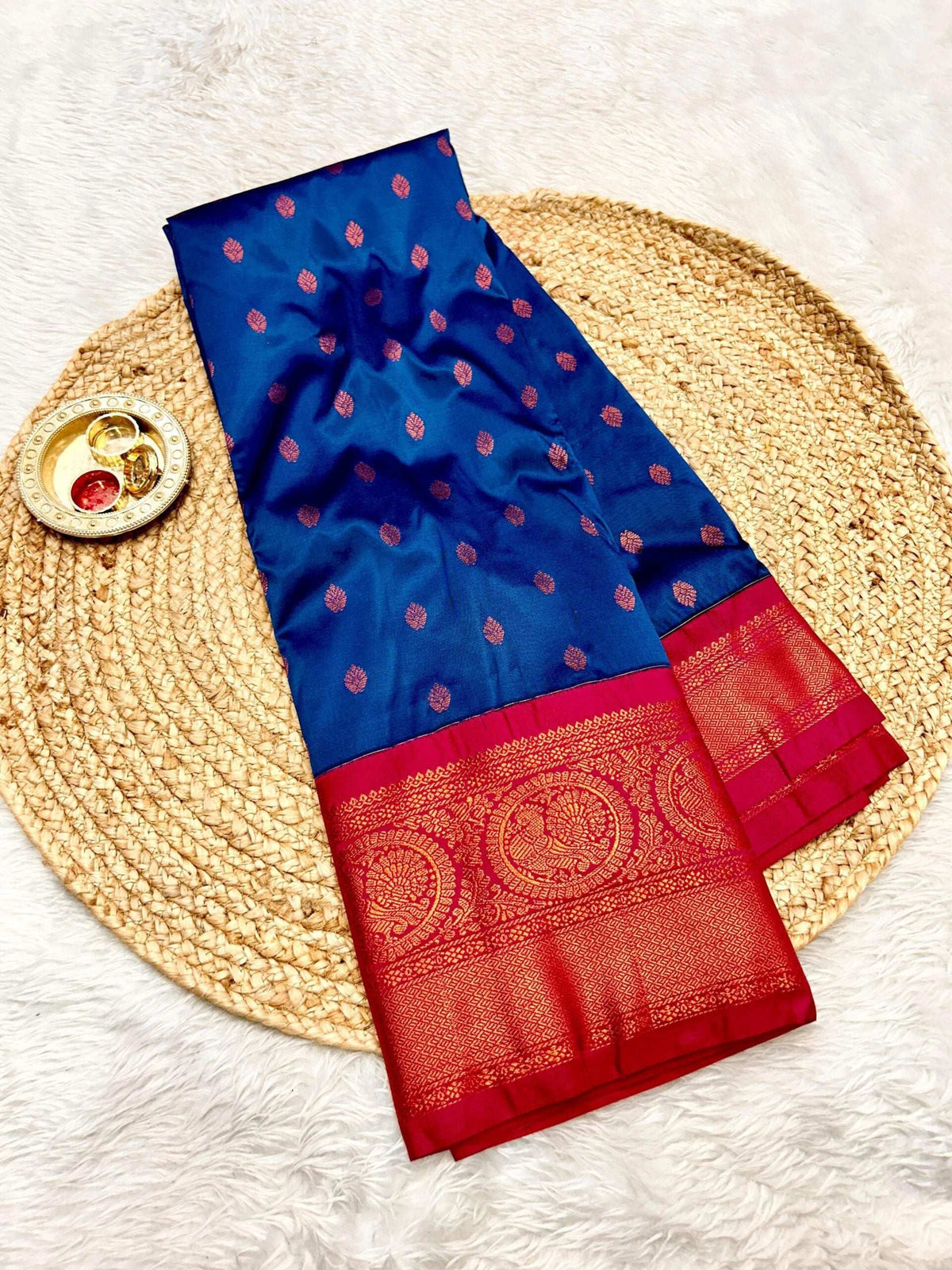 Royal blue Gadwal Paithani with copper bootis and a crimson zari border