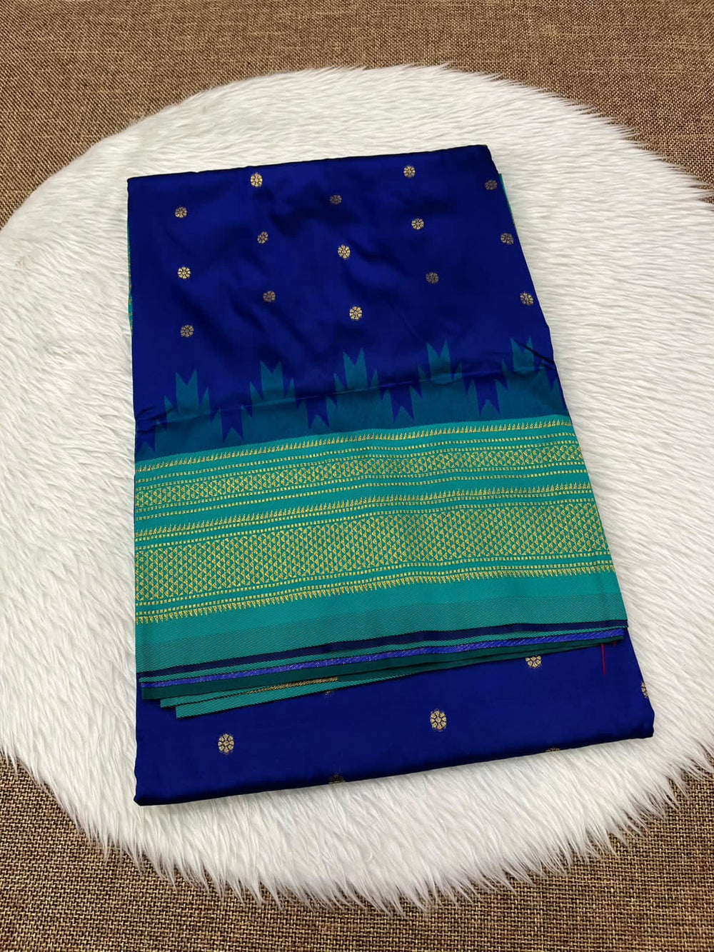 Ilkal silk saree in royal blue with a teal temple border and gold buttis