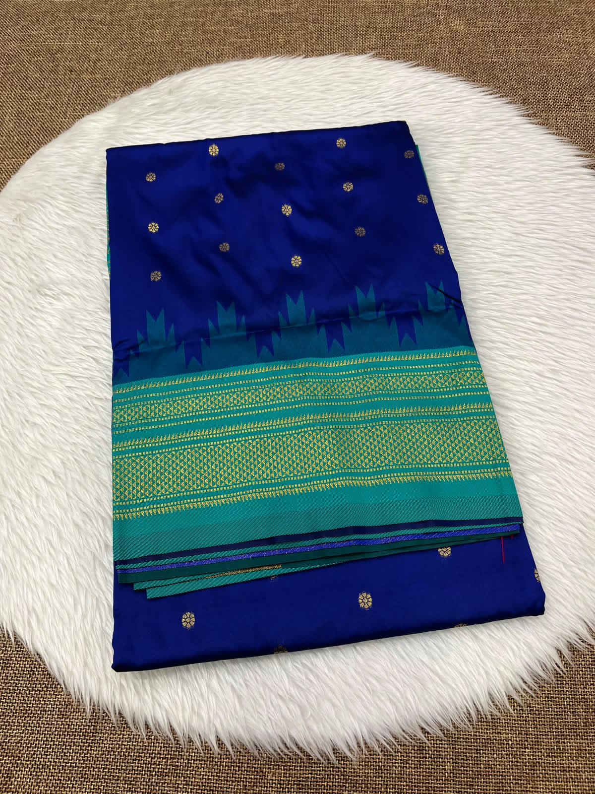 Ilkal silk saree in royal blue with a teal temple border and gold buttis