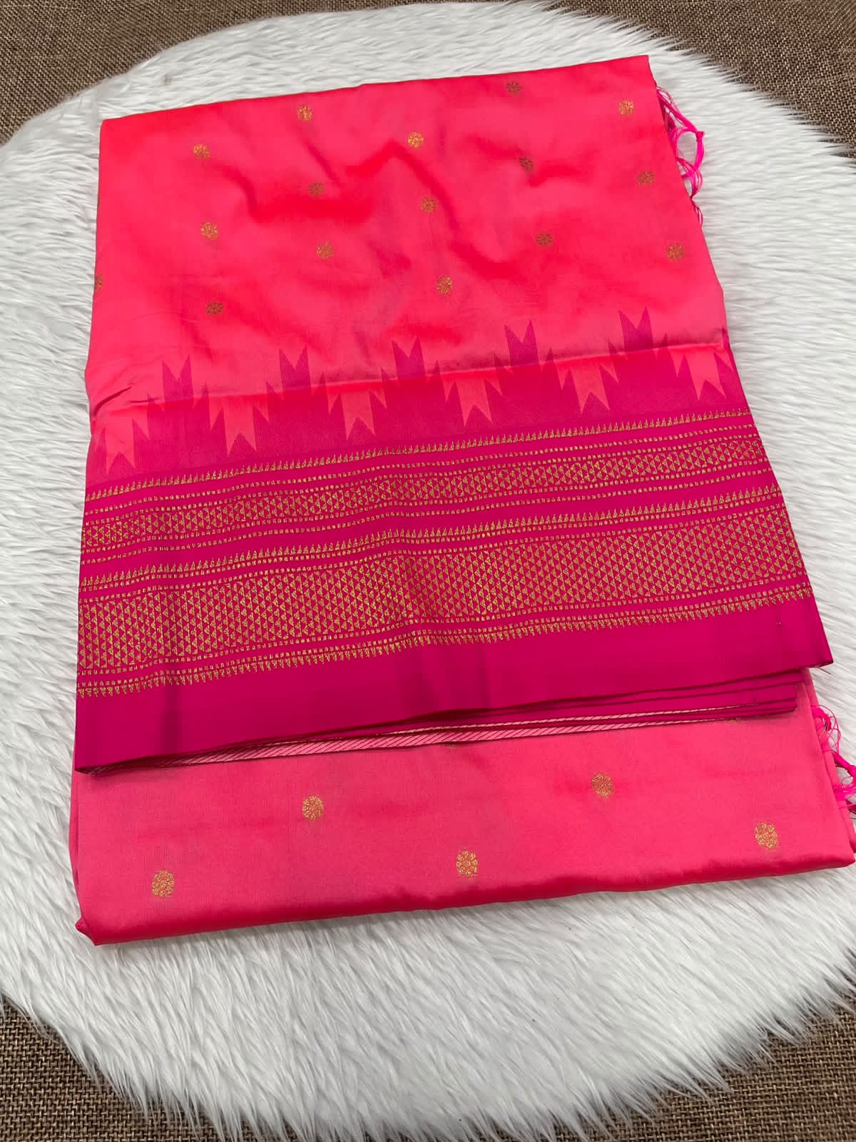 Ilkal silk saree in coral pink with a magenta temple border and gold buttis