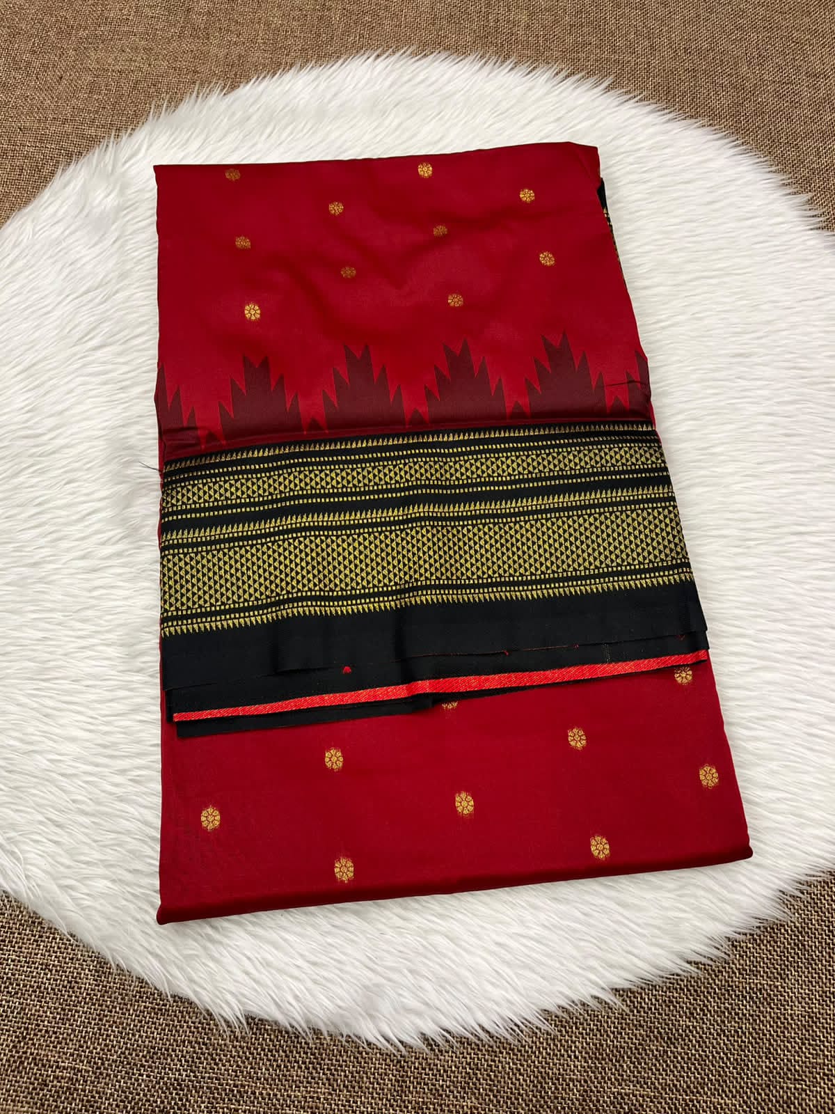 Ilkal silk saree in red with a black and gold temple border