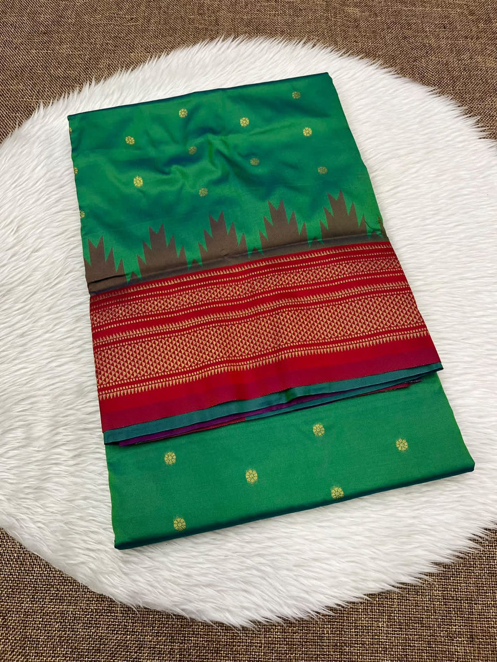 Ilkal silk saree in green with a red temple border and gold buttis