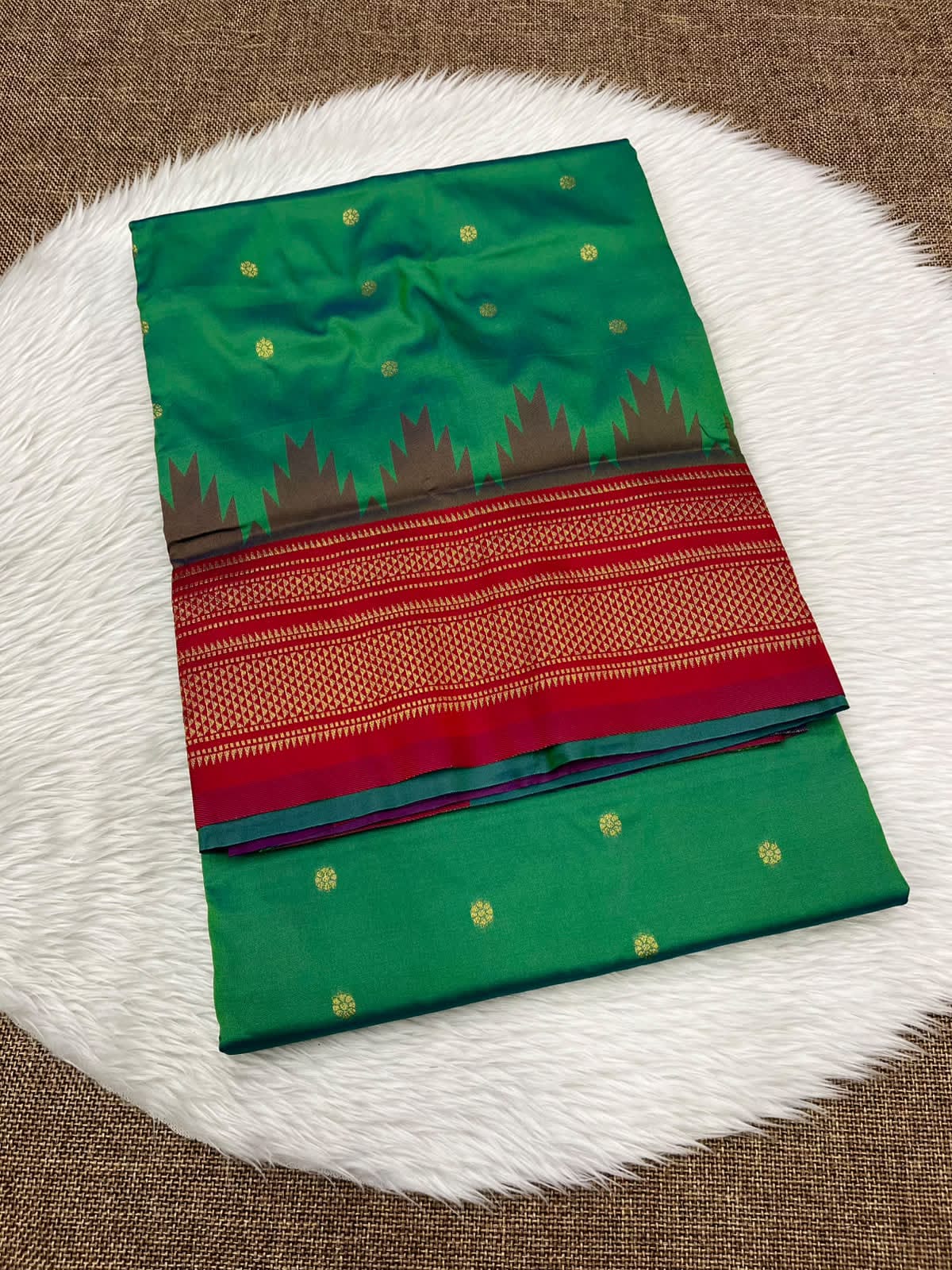 Ilkal silk saree in green with a red temple border and gold buttis