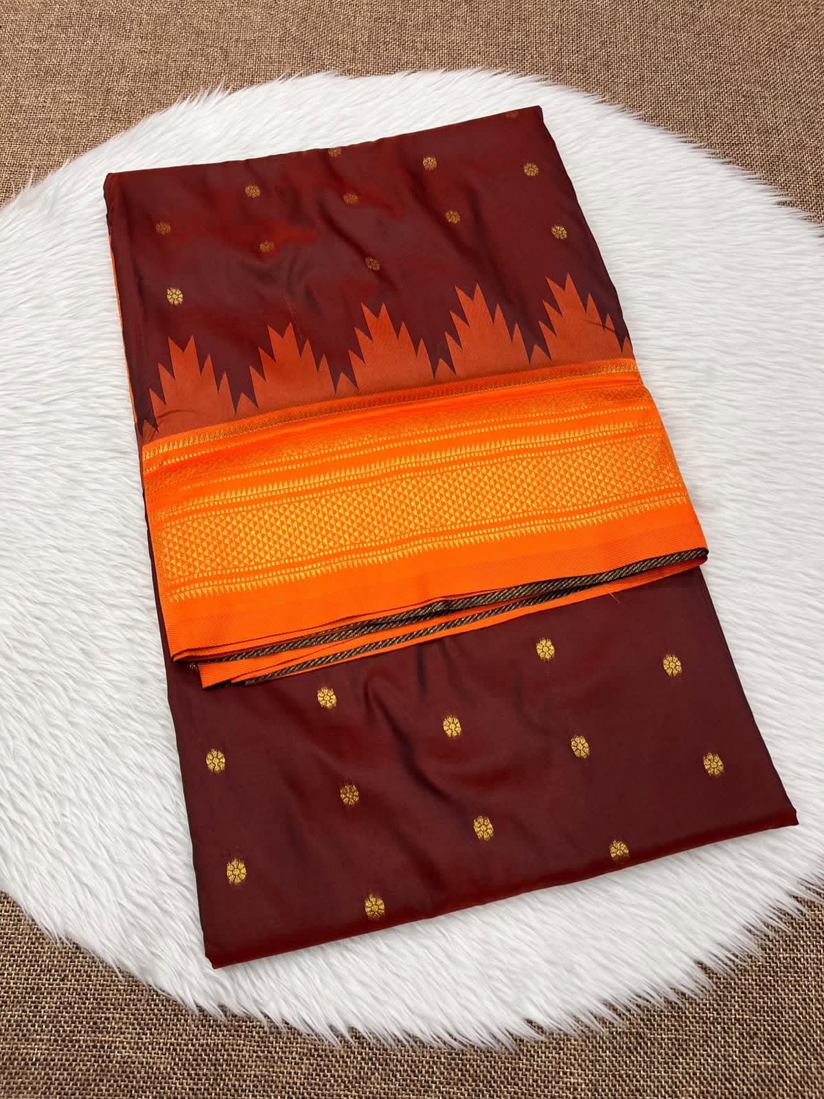 Ilkal silk saree in maroon with an orange temple border and gold buttis