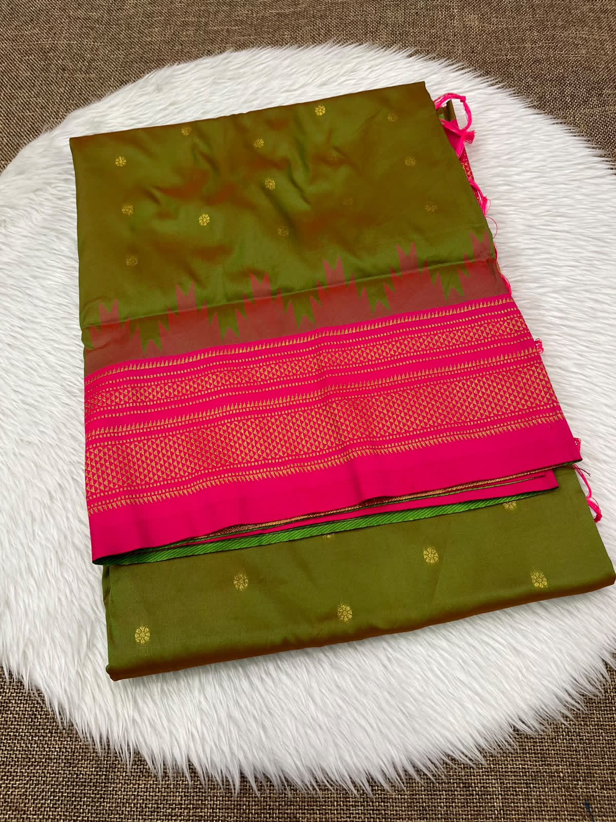 Ilkal silk saree in mehendi green with a pink temple border and gold buttis