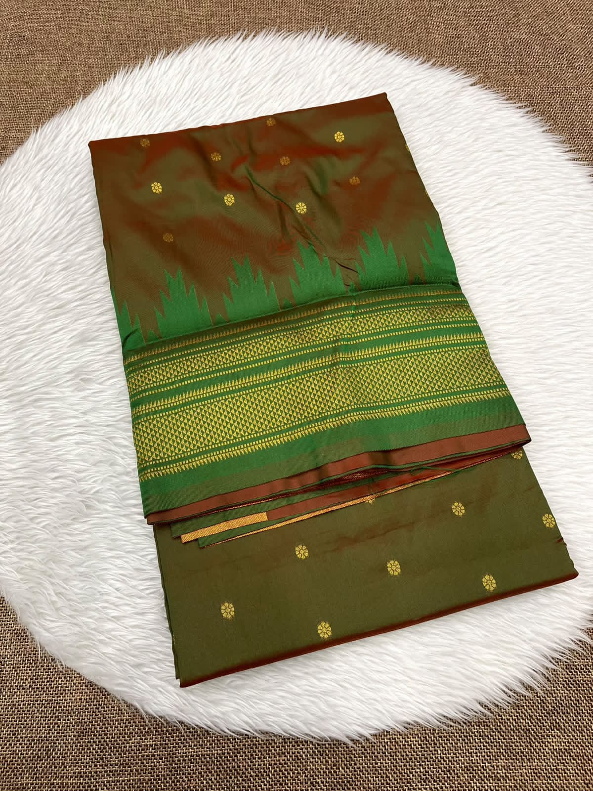 Ilkal silk saree in olive with a green temple border and gold buttis