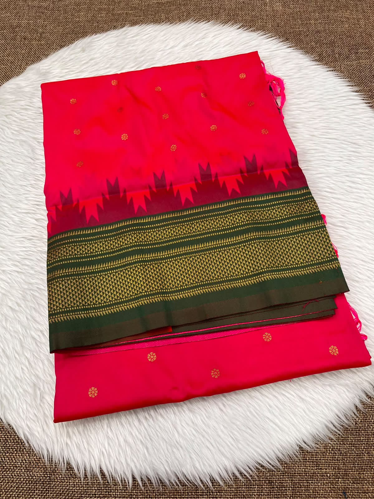 Ilkal silk saree in rose red with a dark green temple border and gold buttis