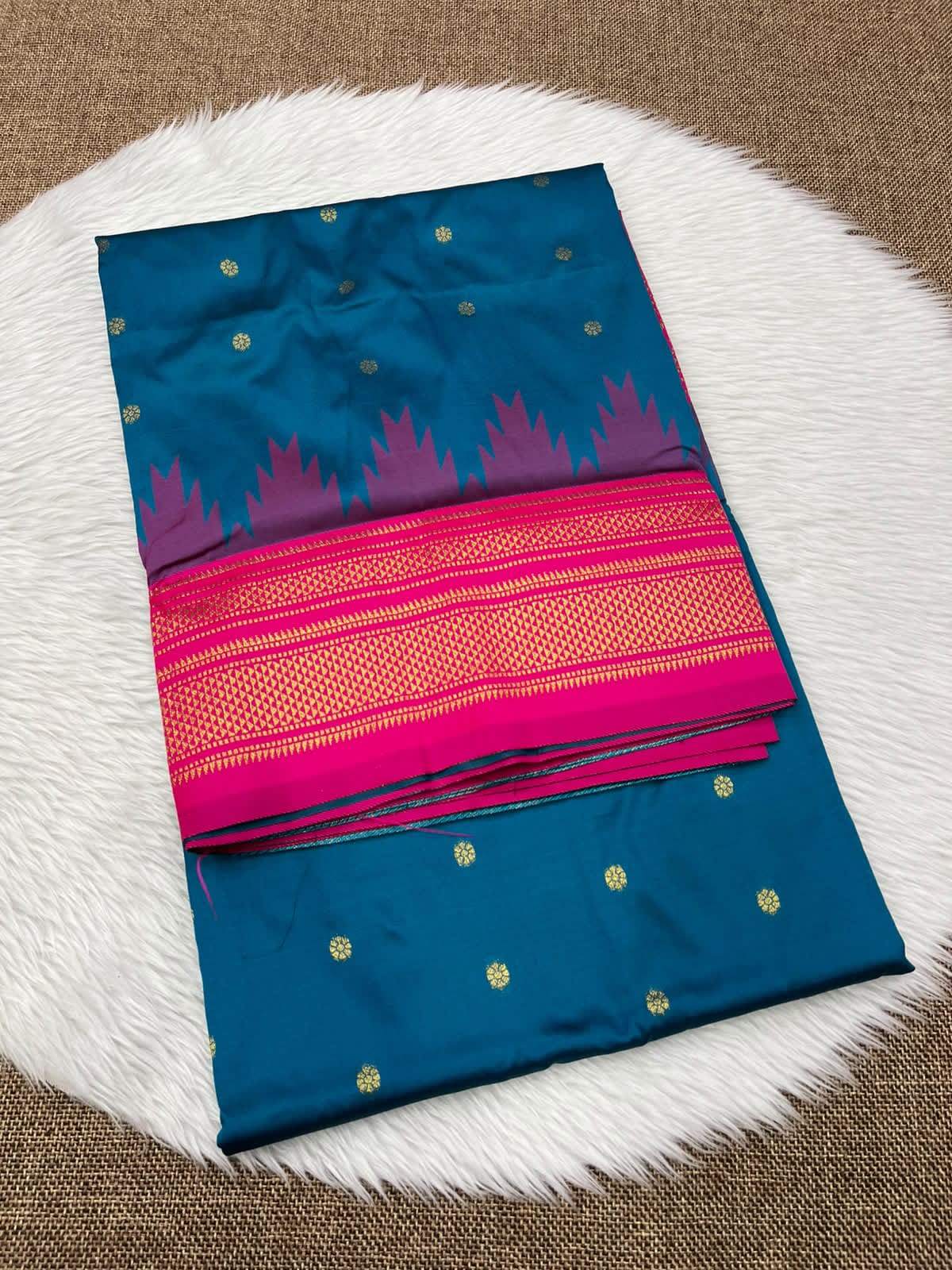 Ilkal silk saree in teal blue with a pink temple border and gold buttis