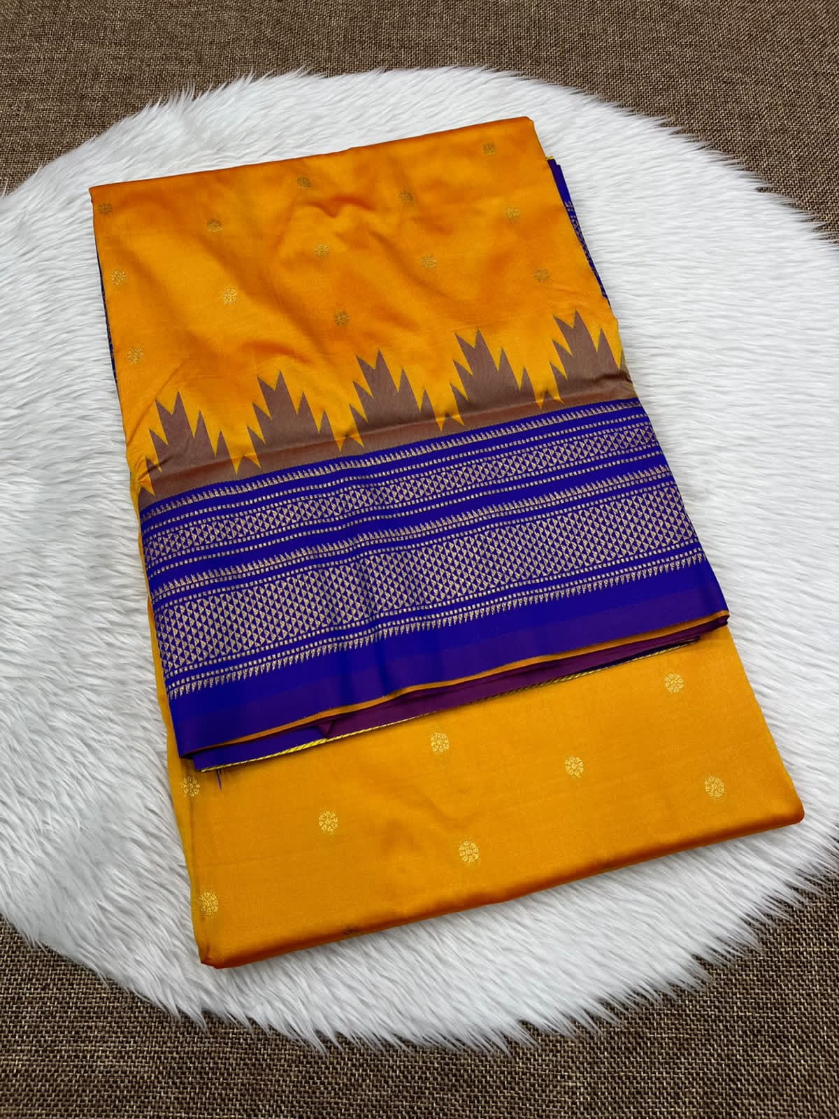 Ilkal silk saree in mustard yellow with a blue temple border and gold buttis