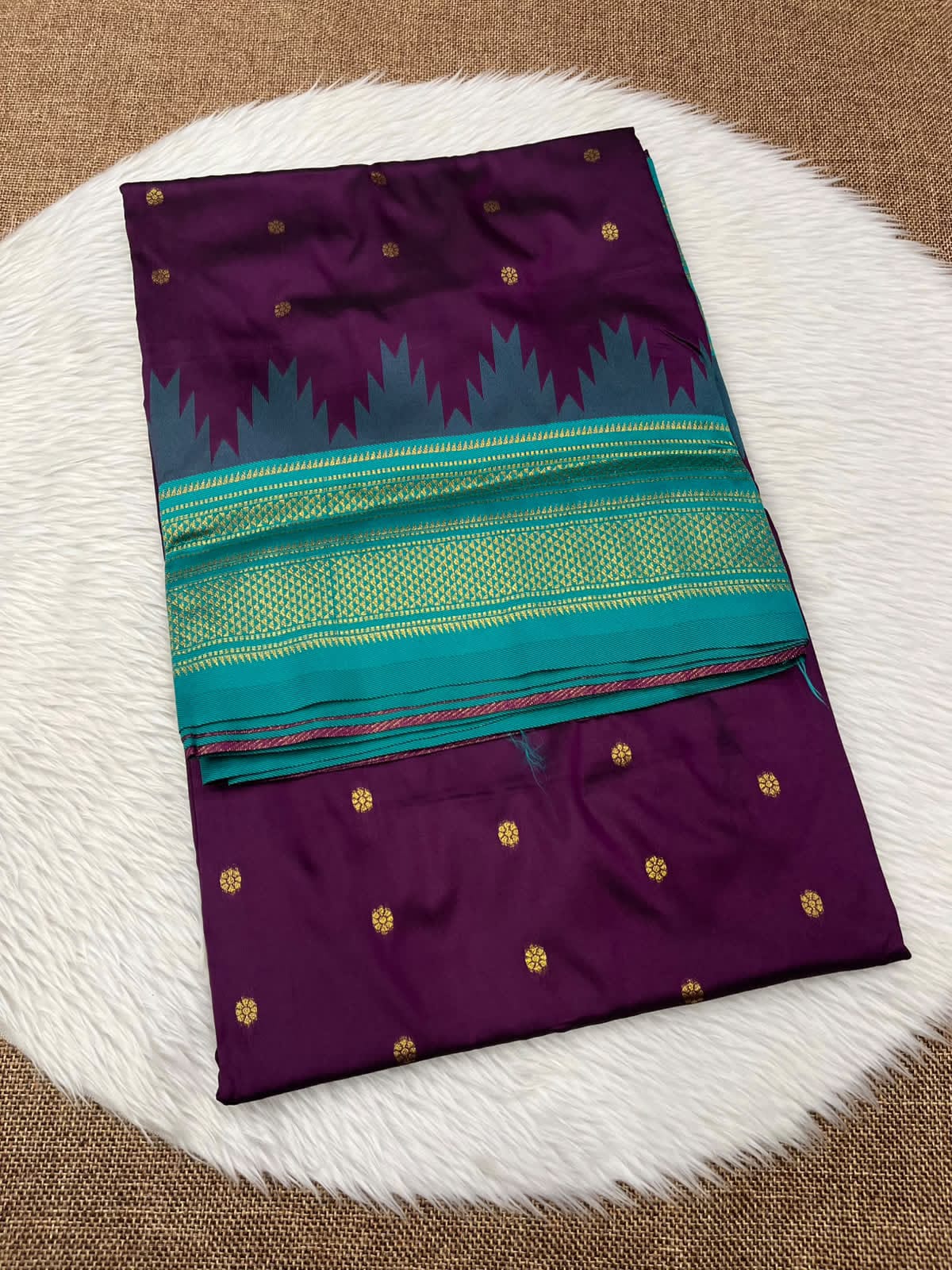 Ilkal silk saree in purple with a teal temple border and gold buttis