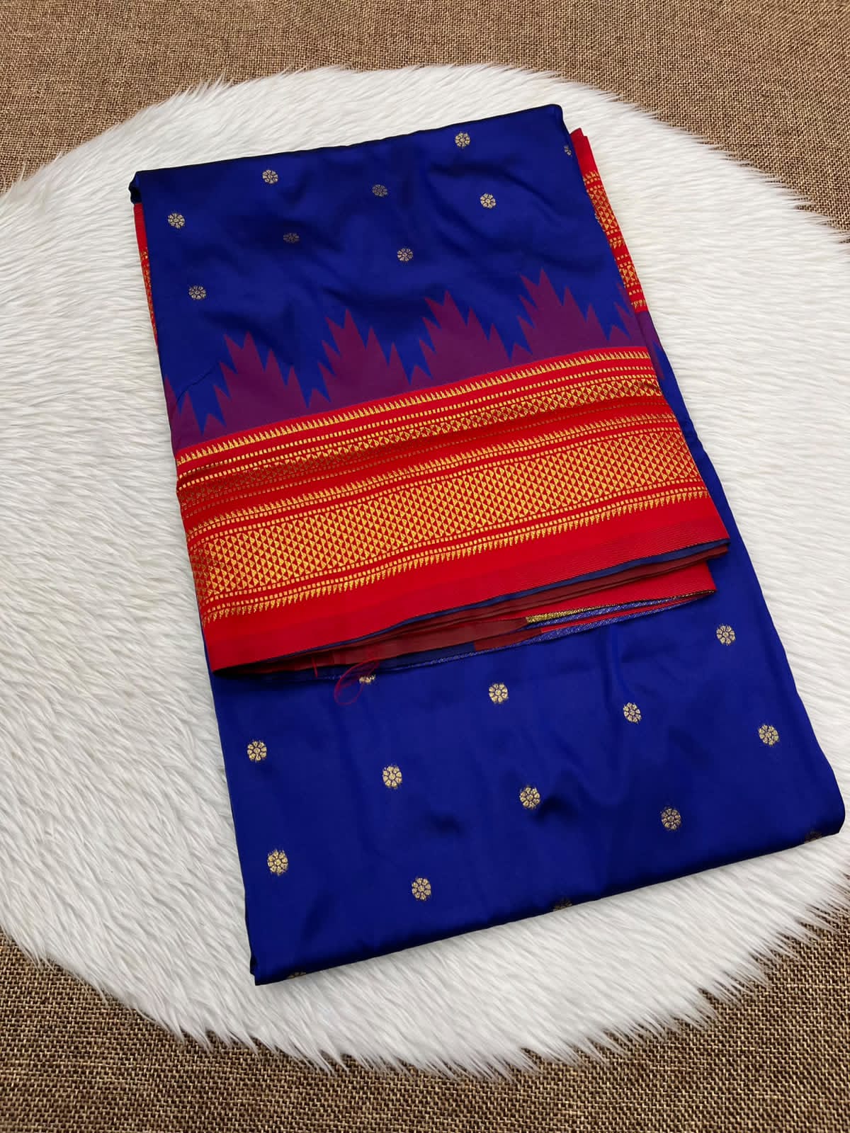 Ilkal silk saree in royal blue with a red temple border and gold buttis
