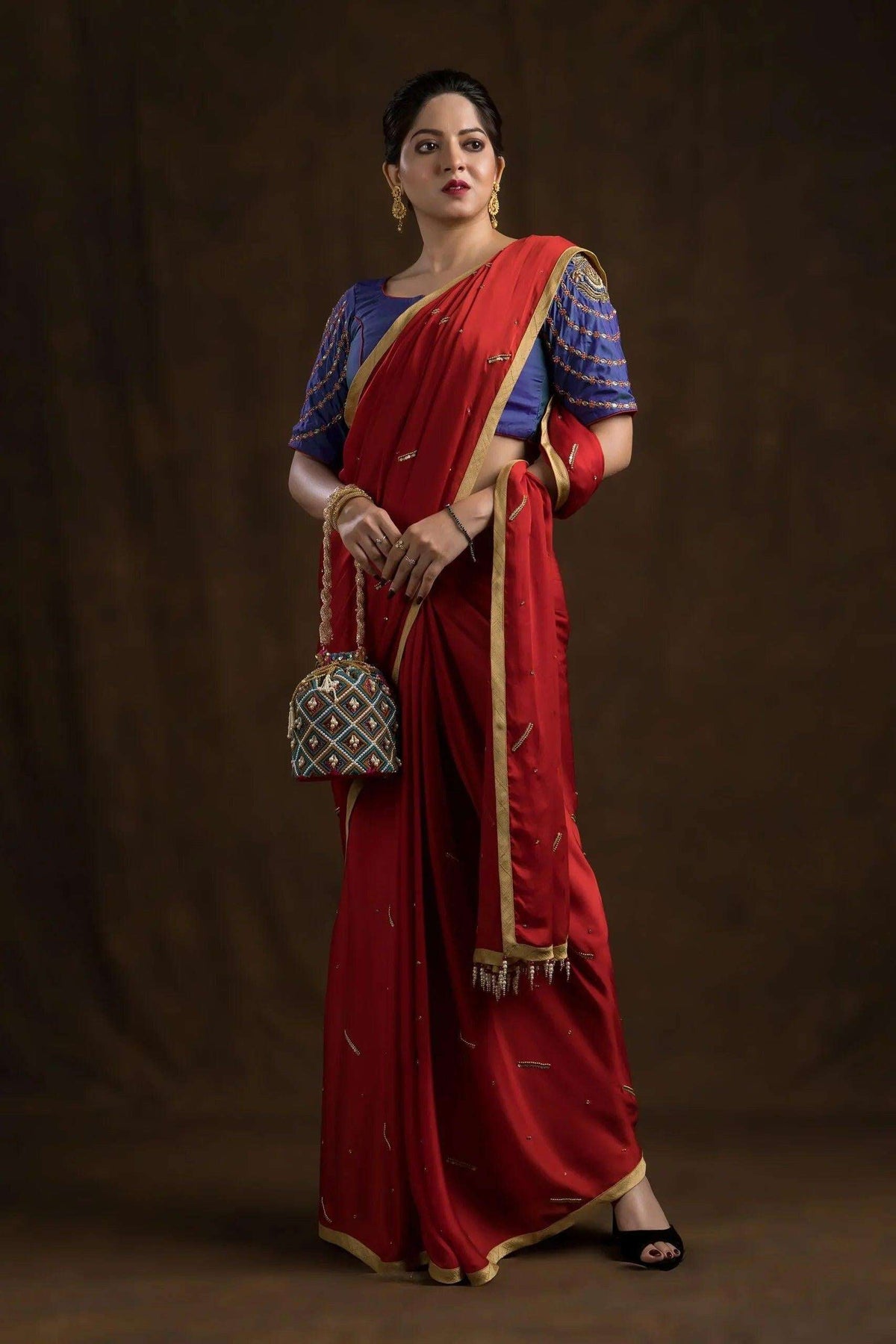 Model in a red saree with the blue-purple Mughal floral embroidered blouse, full length front view